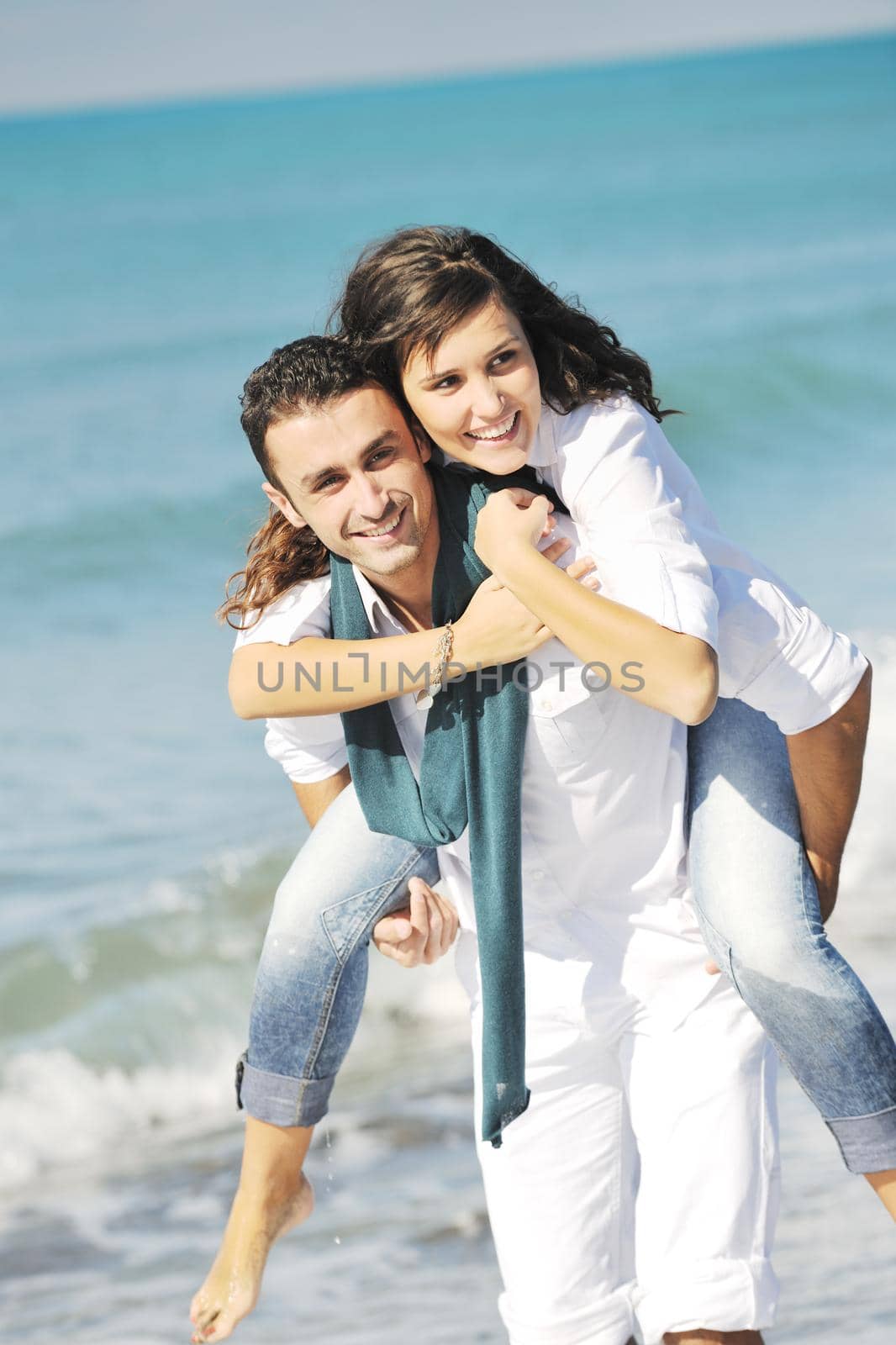 happy young couple in white clothing  have romantic recreation and   fun at beautiful beach on  vacations