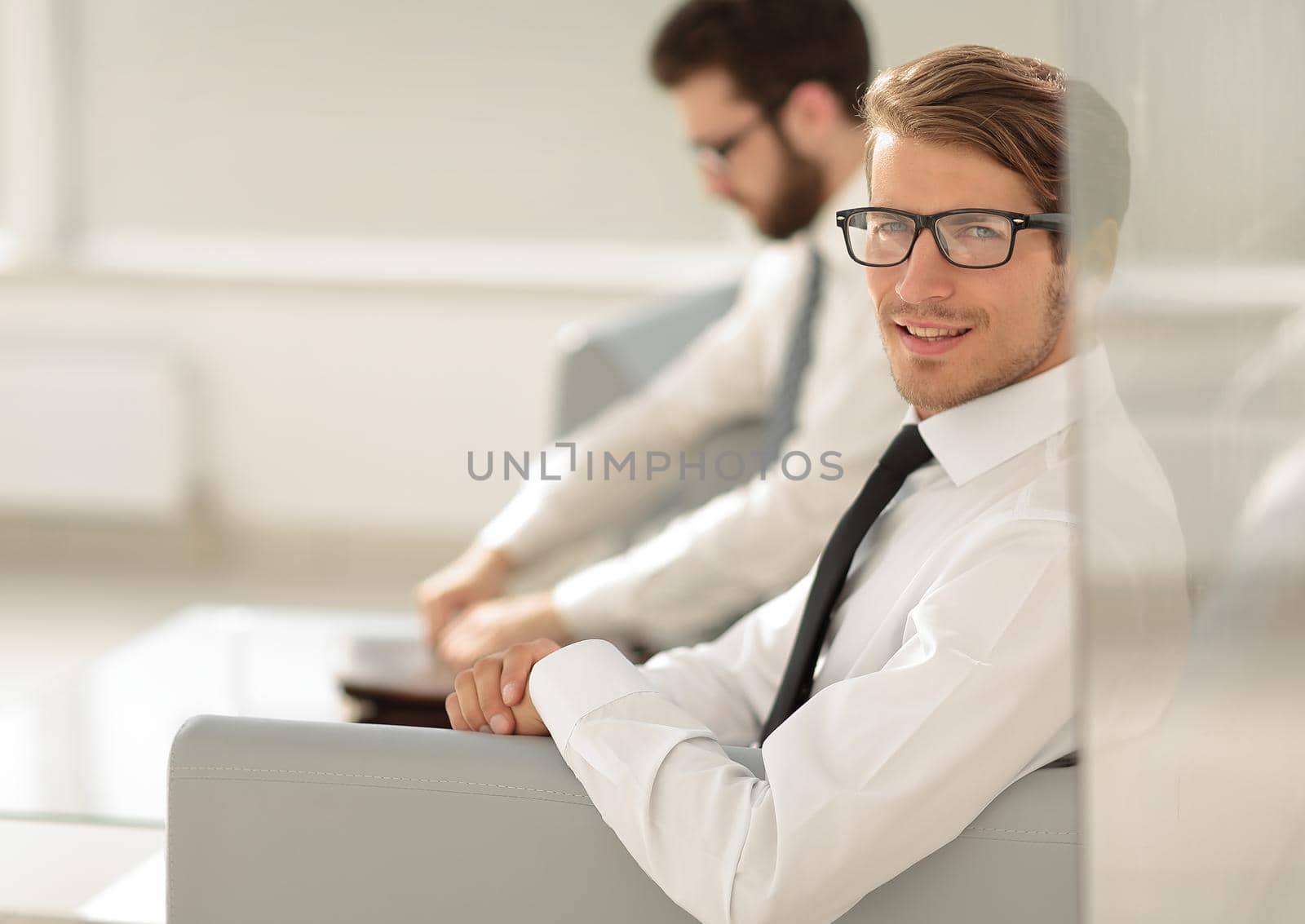 serious employees sitting in the office waiting room.photo with copy and space