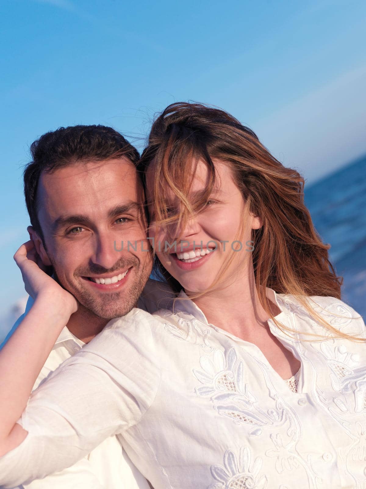 young couple  on beach have fun by dotshock