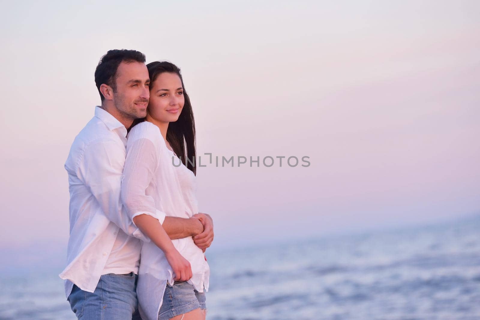 young couple  on beach have fun by dotshock