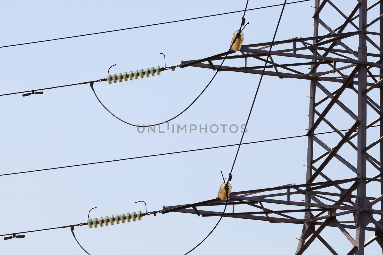 High voltage electrical power pylon lines and insulators Abstract close-up