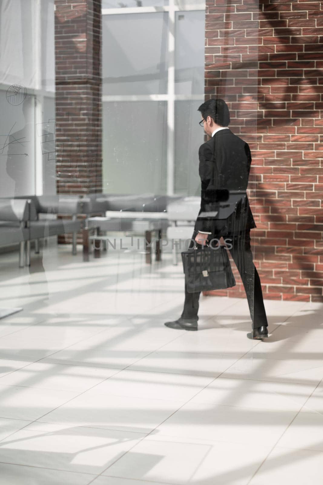 businessman walks in his office.business concept