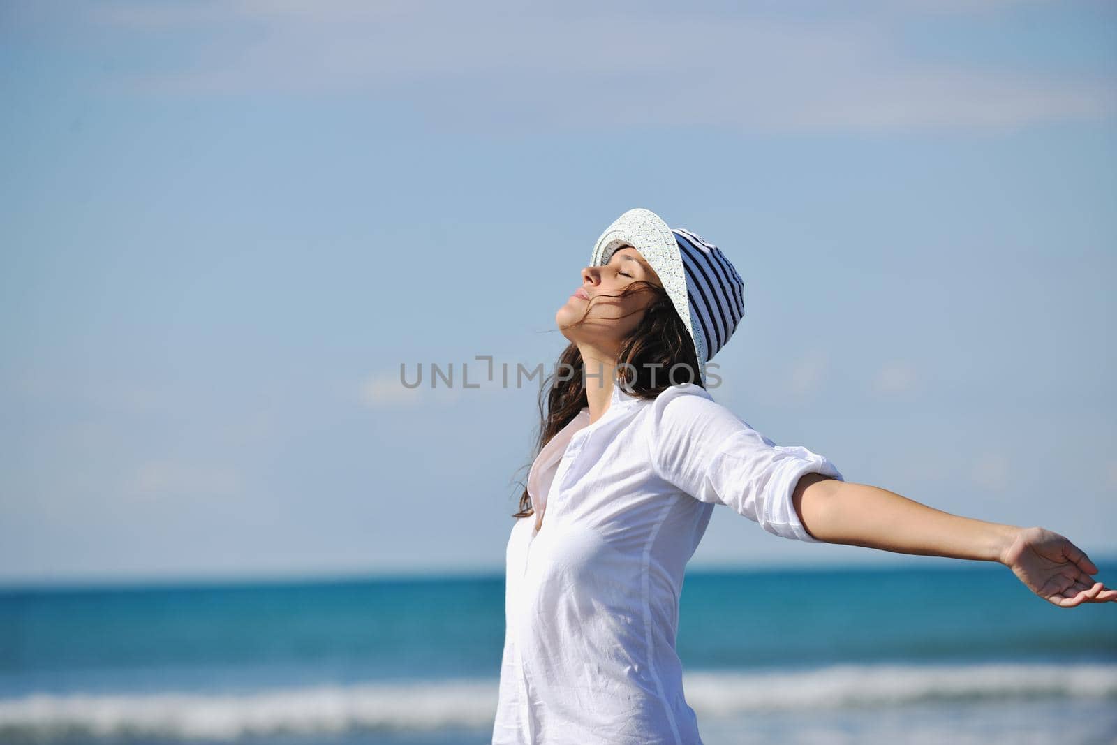 happy young woman relax onbeautiful  beach at morning