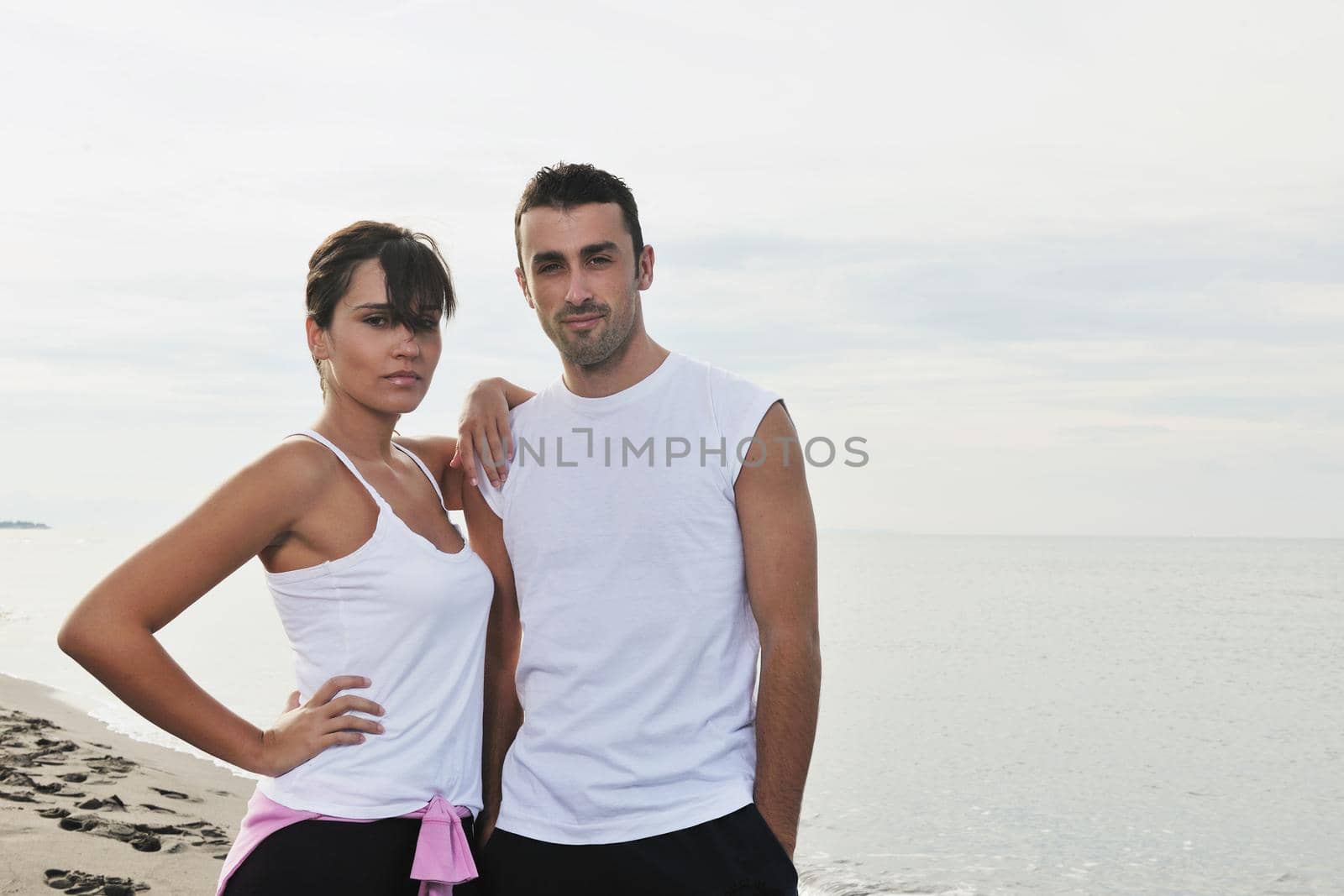 happy young couple in white clothing  have romantic recreation and   fun at beautiful beach on  vacations