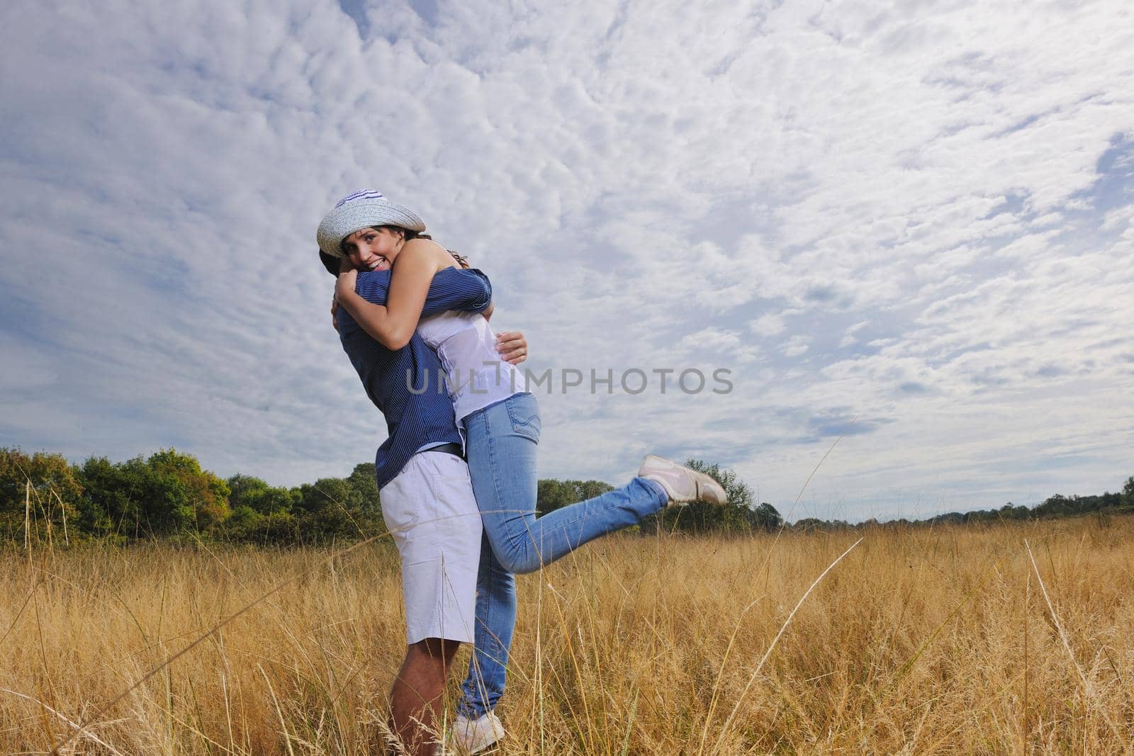 happy young couple have romantic time outdoor while smiling and hug