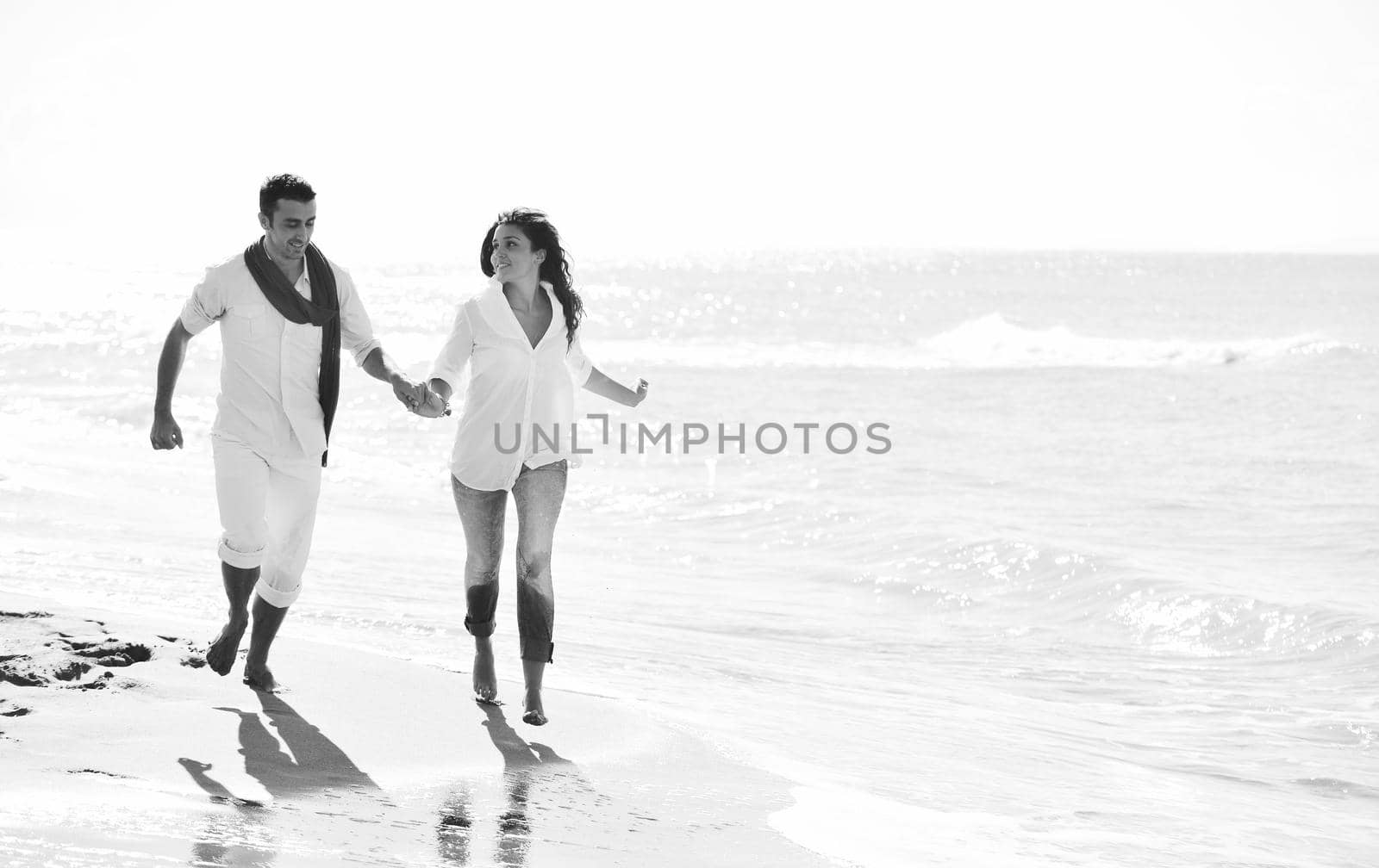 happy young couple in white clothing  have romantic recreation and   fun at beautiful beach on  vacations