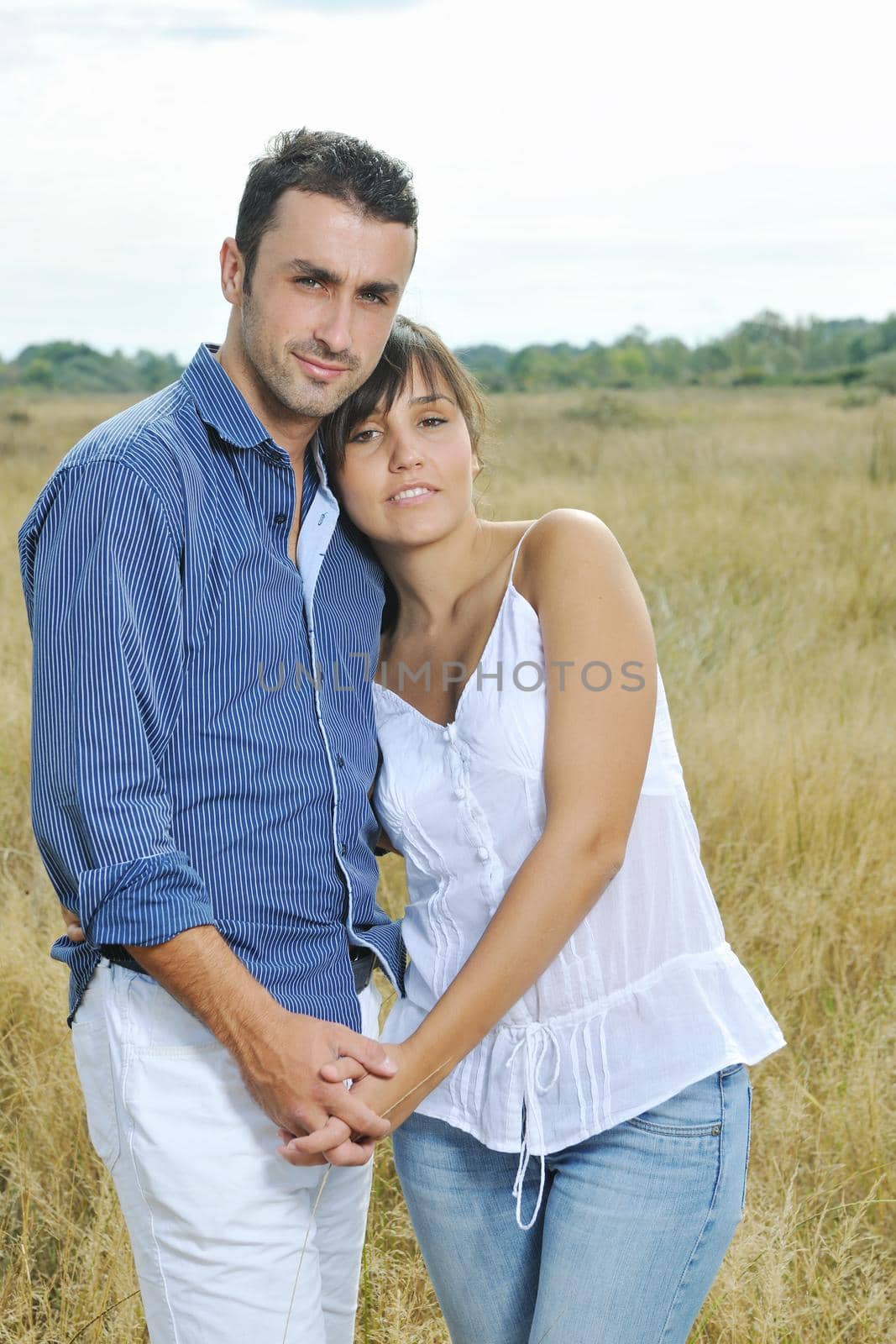 happy young couple have romantic time outdoor while smiling and hug