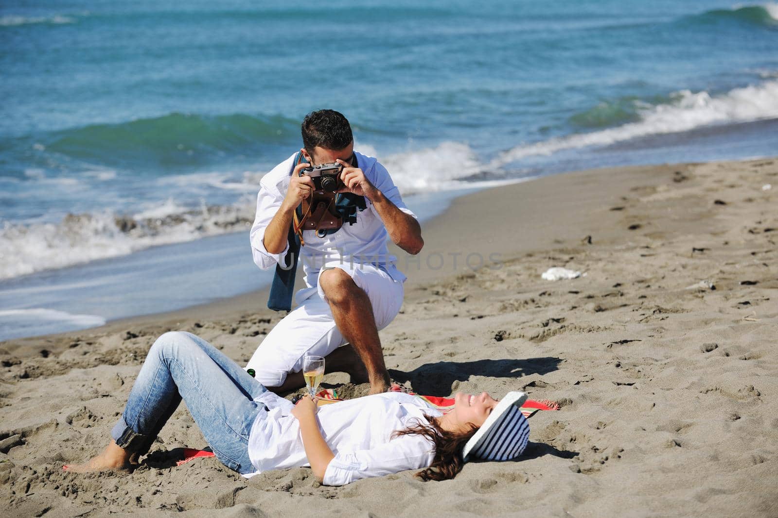 happy young couple relaxing in nature white making photos and taking images and posing for camera