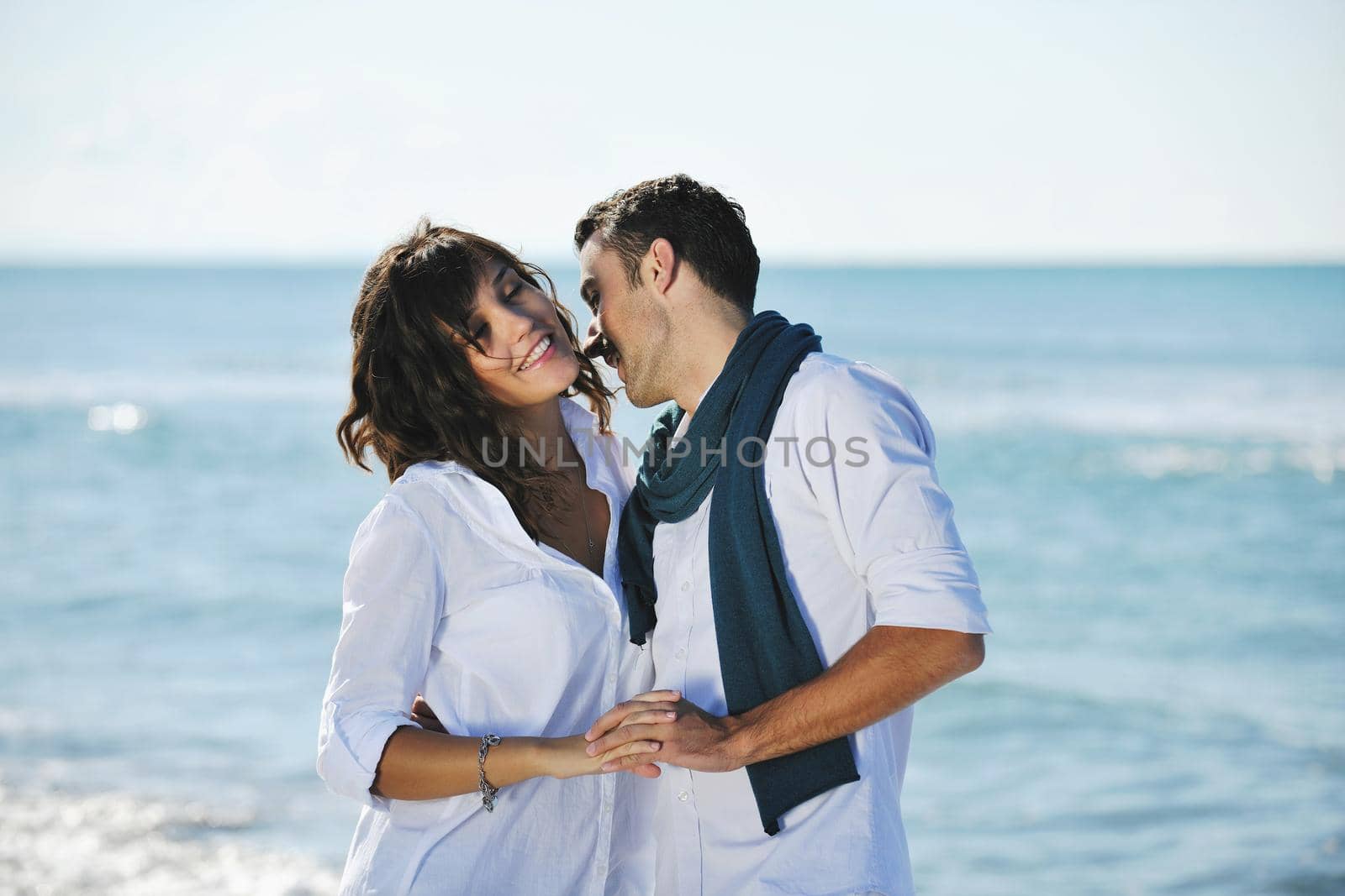 happy young couple in white clothing  have romantic recreation and   fun at beautiful beach on  vacations