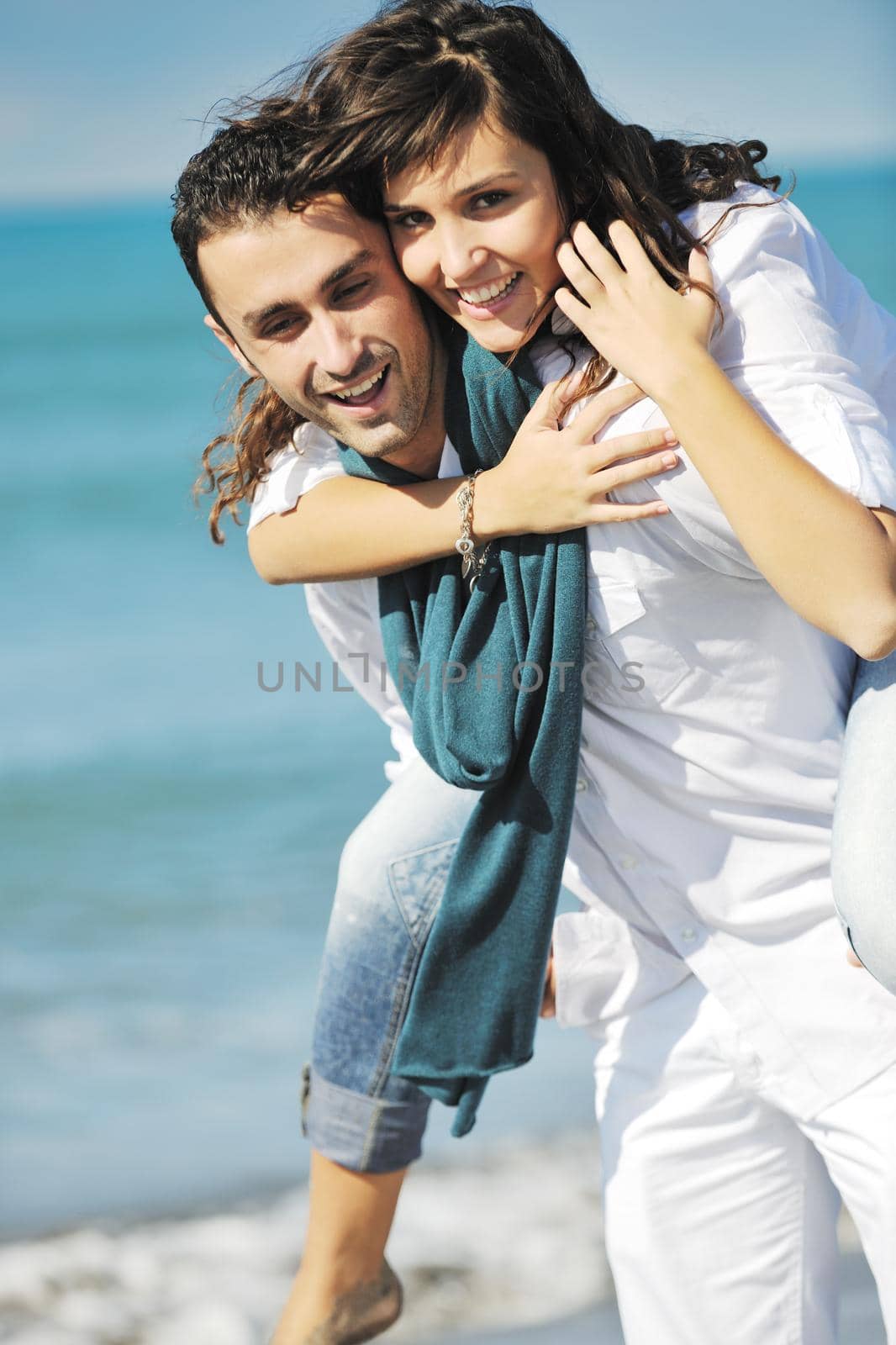 happy young couple in white clothing  have romantic recreation and   fun at beautiful beach on  vacations