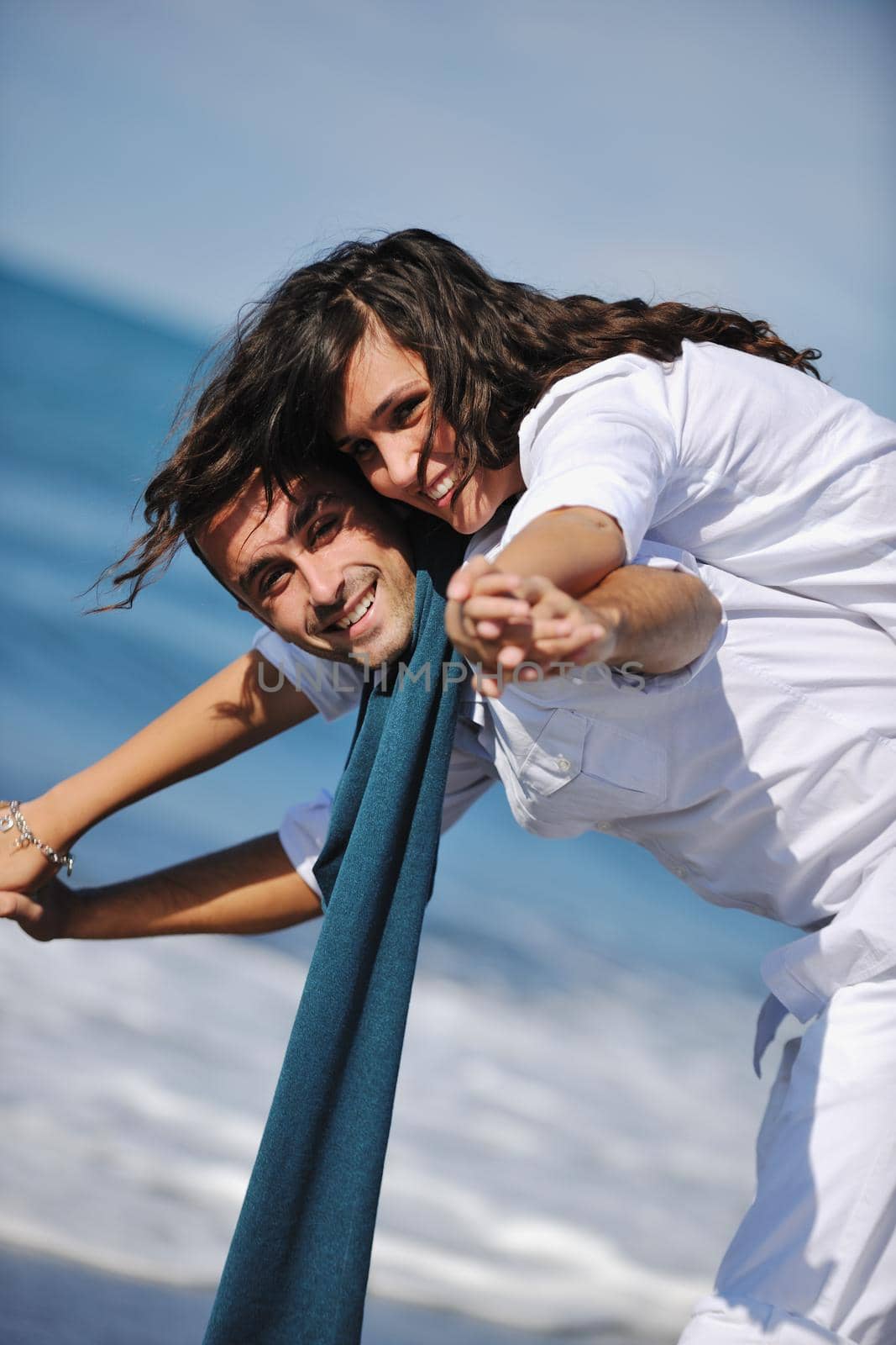 happy young couple in white clothing  have romantic recreation and   fun at beautiful beach on  vacations