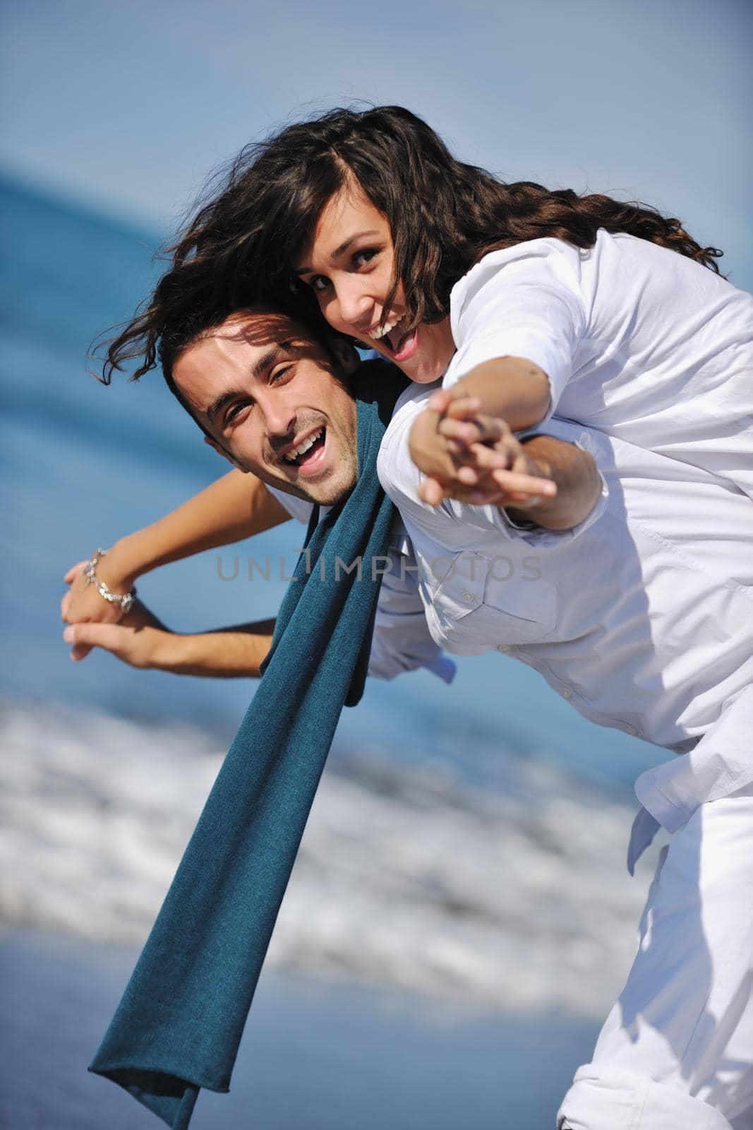 happy young couple in white clothing  have romantic recreation and   fun at beautiful beach on  vacations