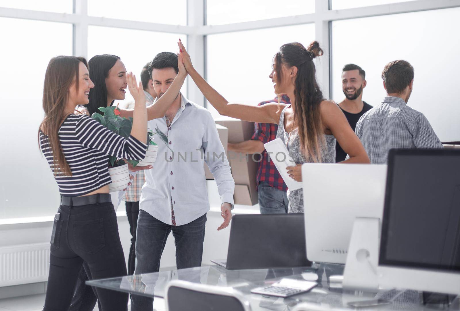 happy business team in new office.the concept of moving
