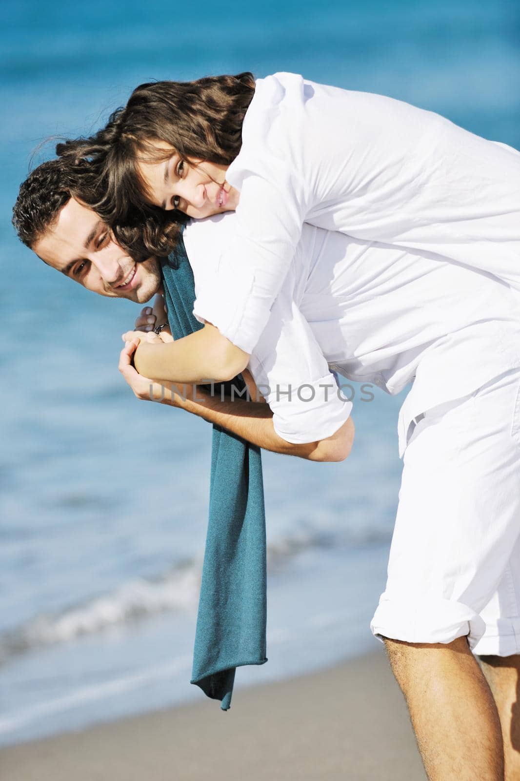 happy young couple in white clothing  have romantic recreation and   fun at beautiful beach on  vacations