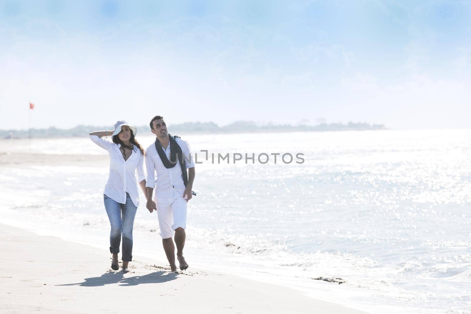 happy young couple in white clothing  have romantic recreation and   fun at beautiful beach on  vacations