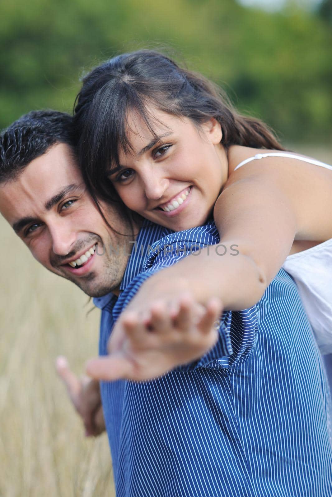 happy young couple have romantic time outdoor while smiling and hug