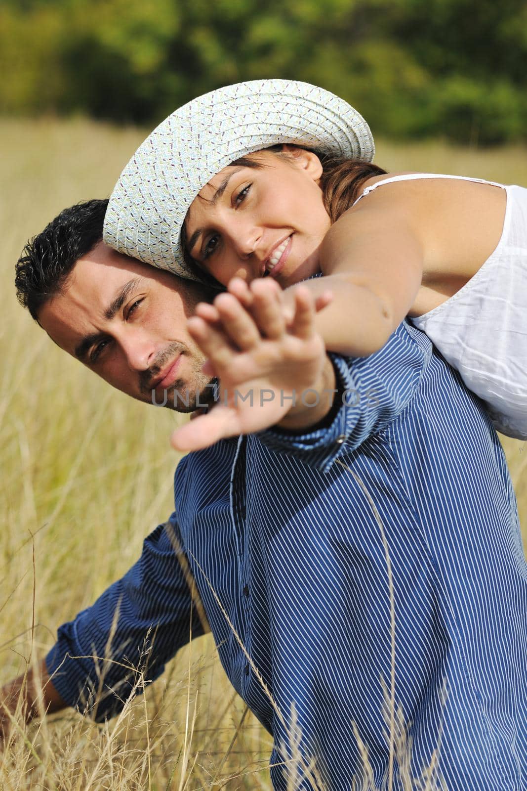 happy young couple have romantic time outdoor while smiling and hug