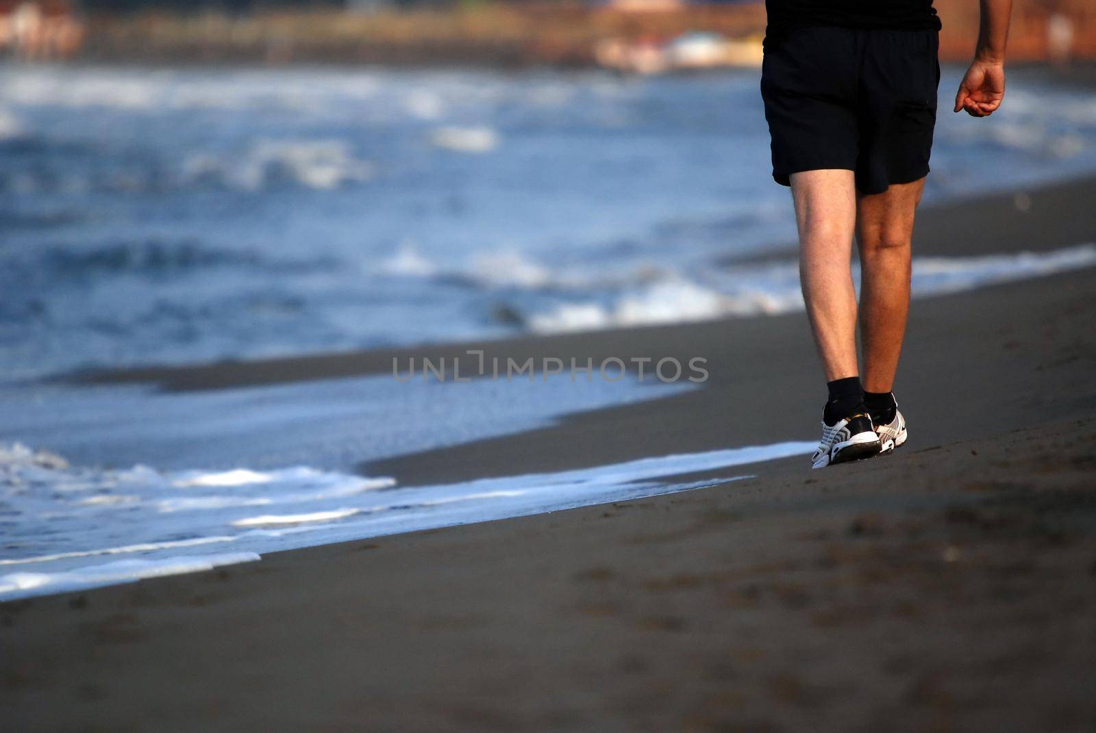 man running on beach