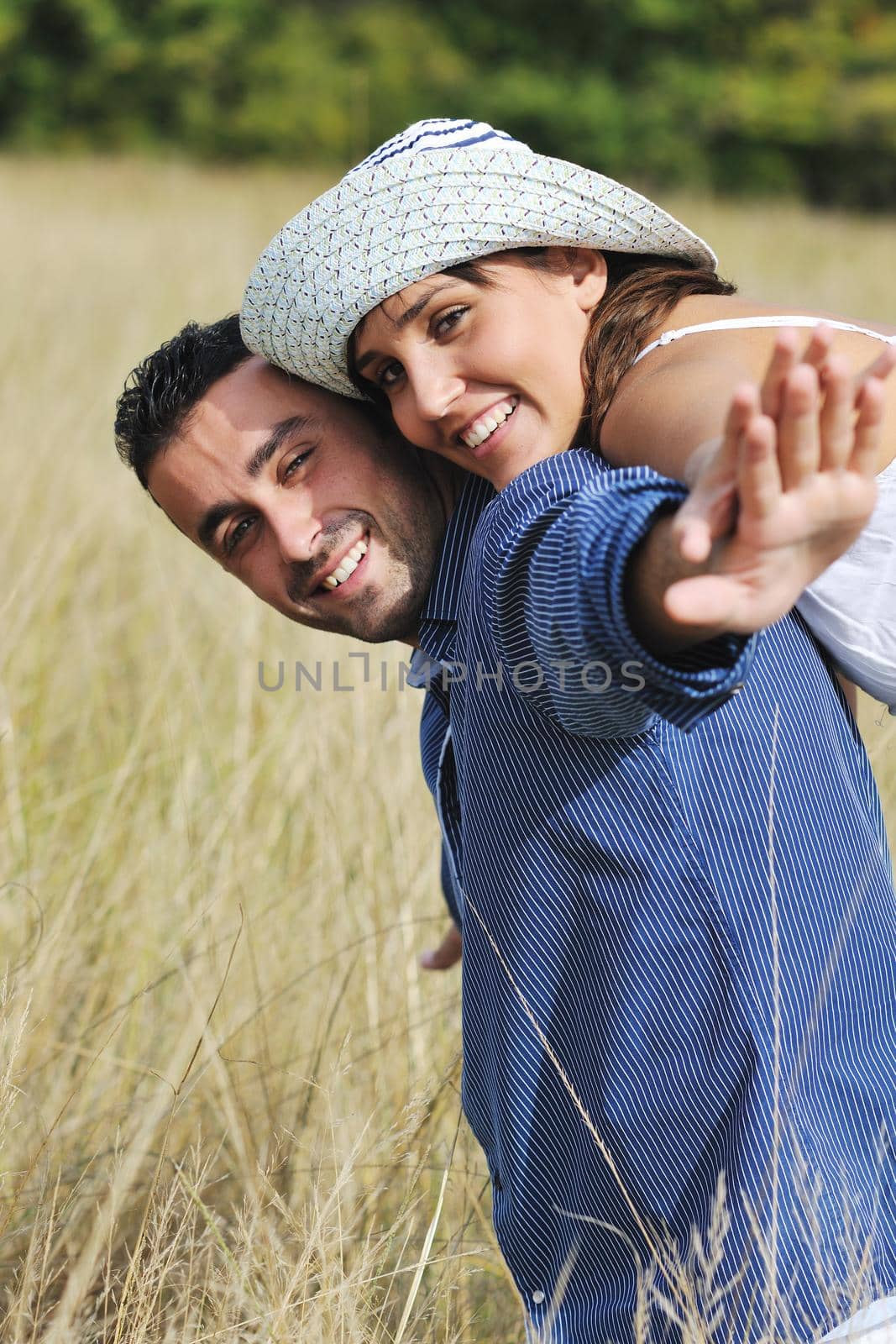 happy young couple have romantic time outdoor while smiling and hug