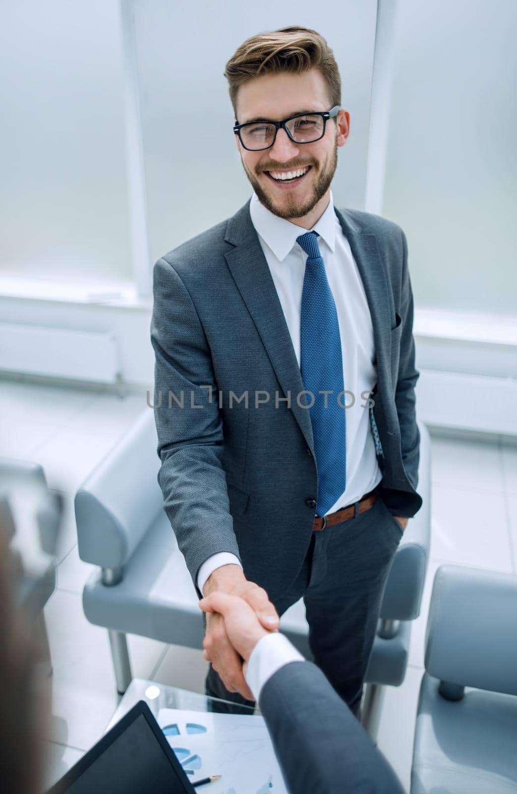 close up.a successful businessman welcomes a business partner.business concept