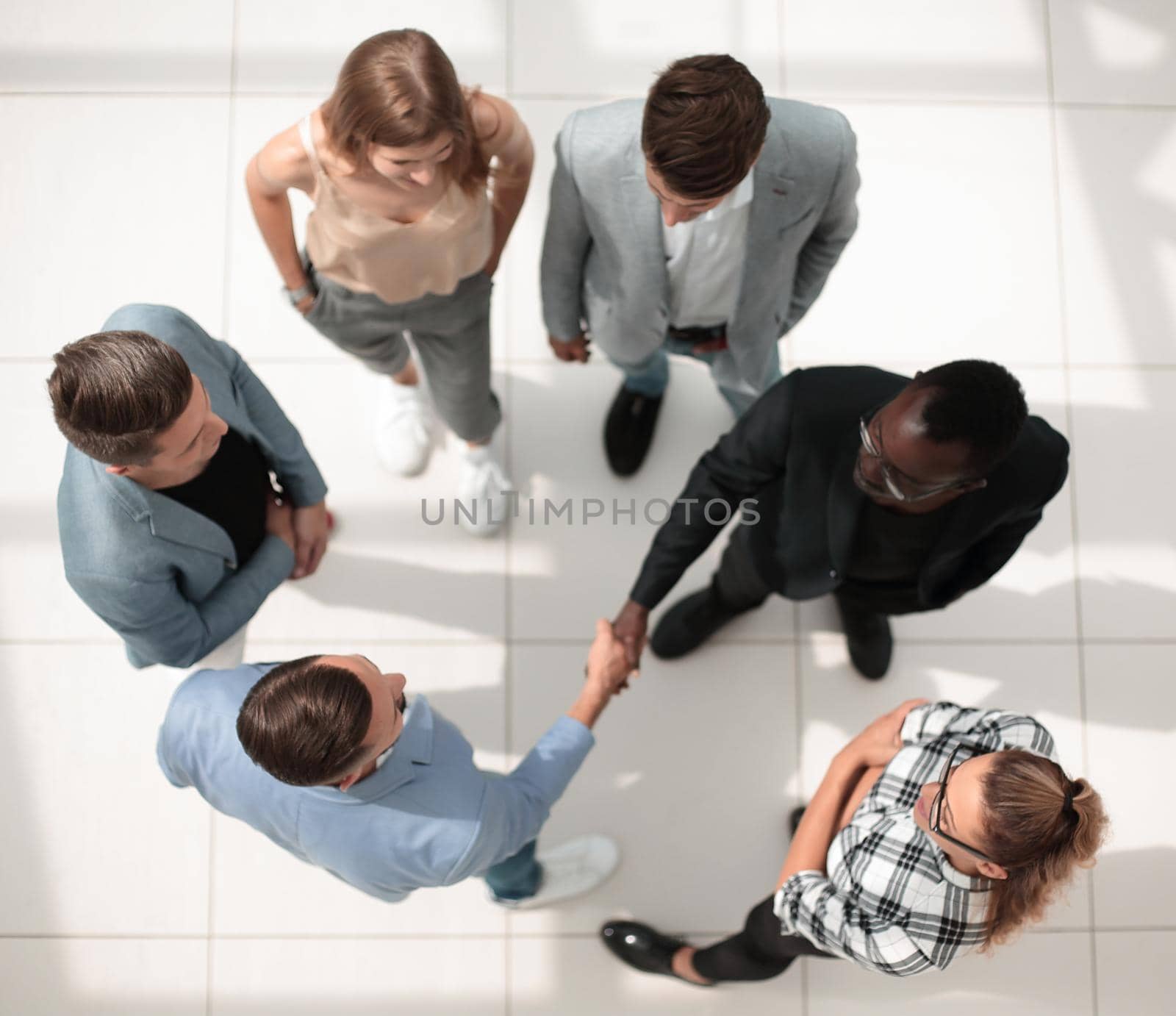Handshake of business group leader, applause