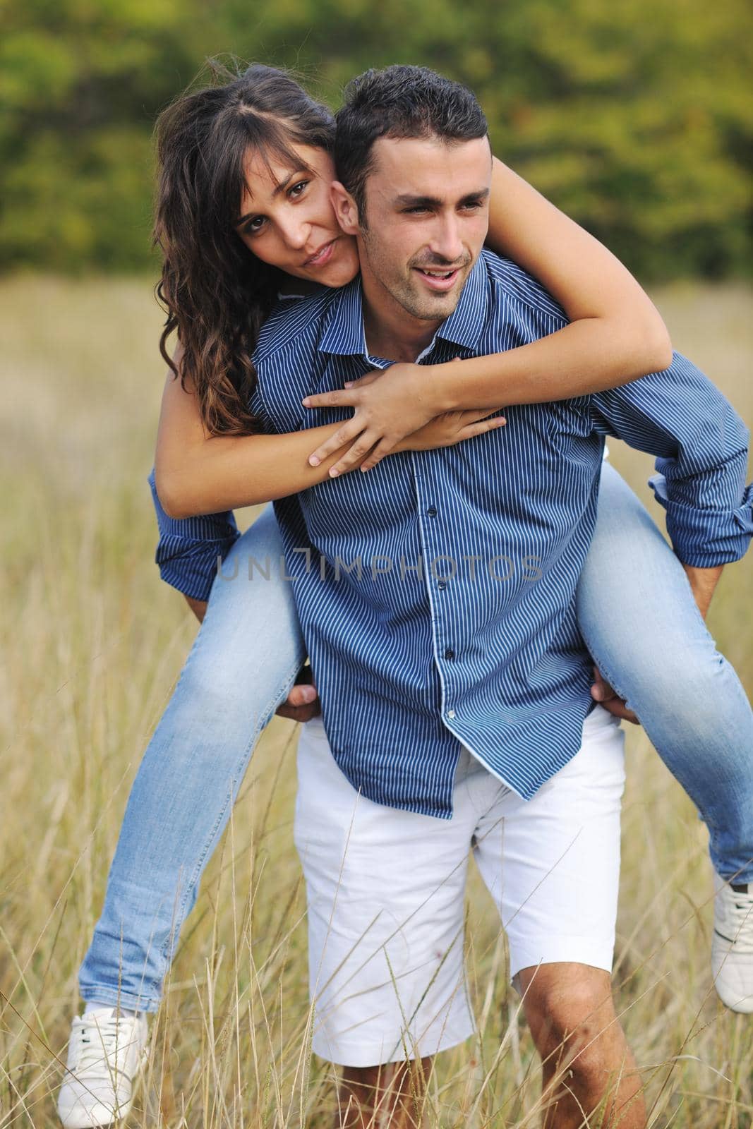 happy young couple have romantic time outdoor while smiling and hug