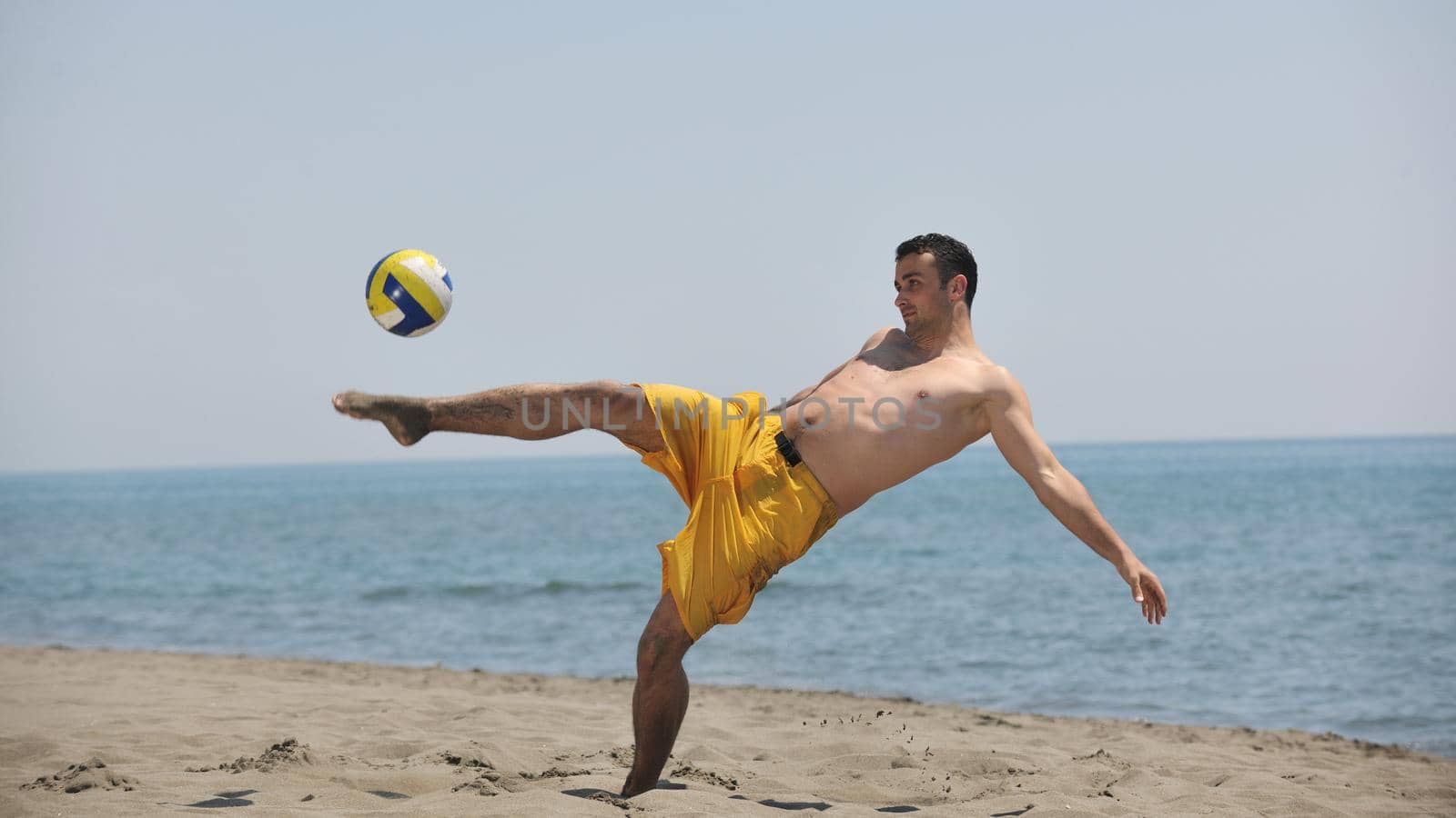 male beach volleyball game player jump on hot sand