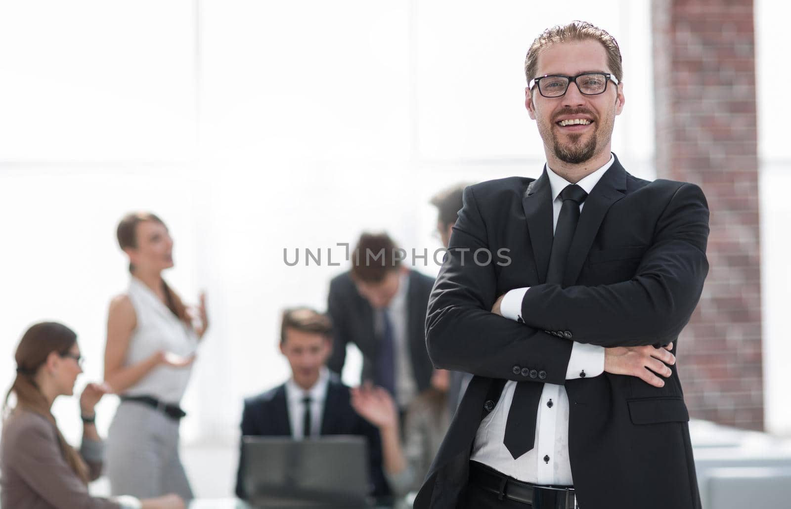 successful businessman on the background of the office .photo with copy space