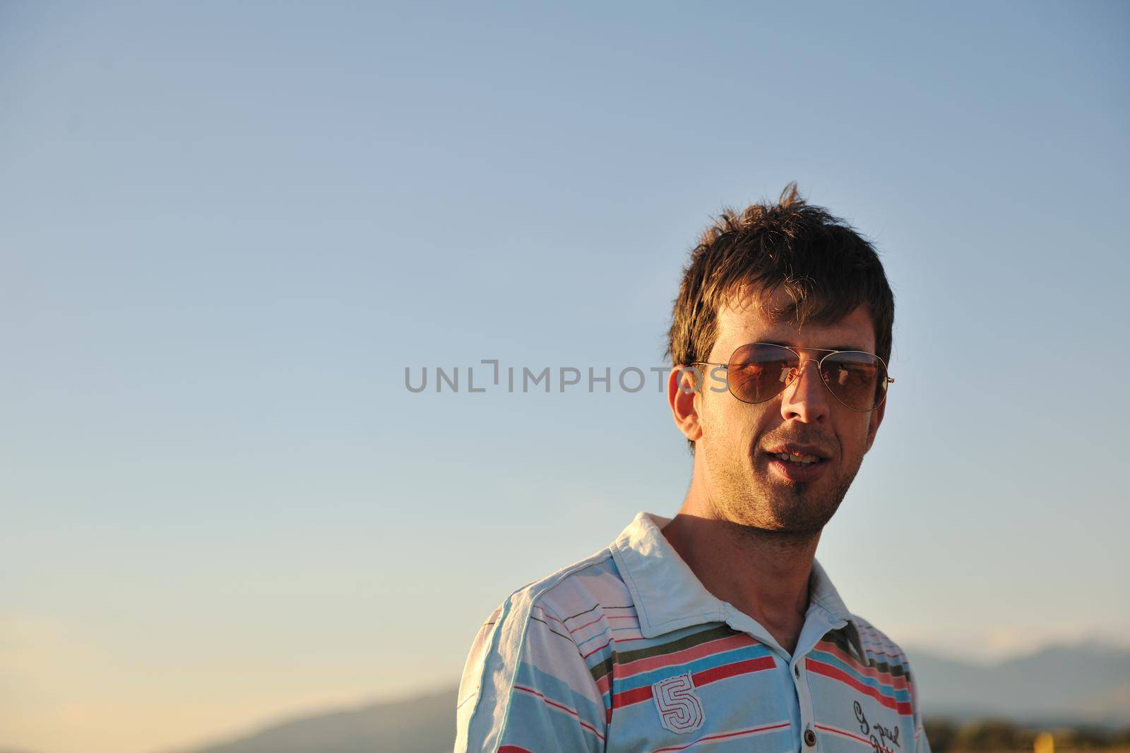 young man have good time and relax at beautifu beach at seaside