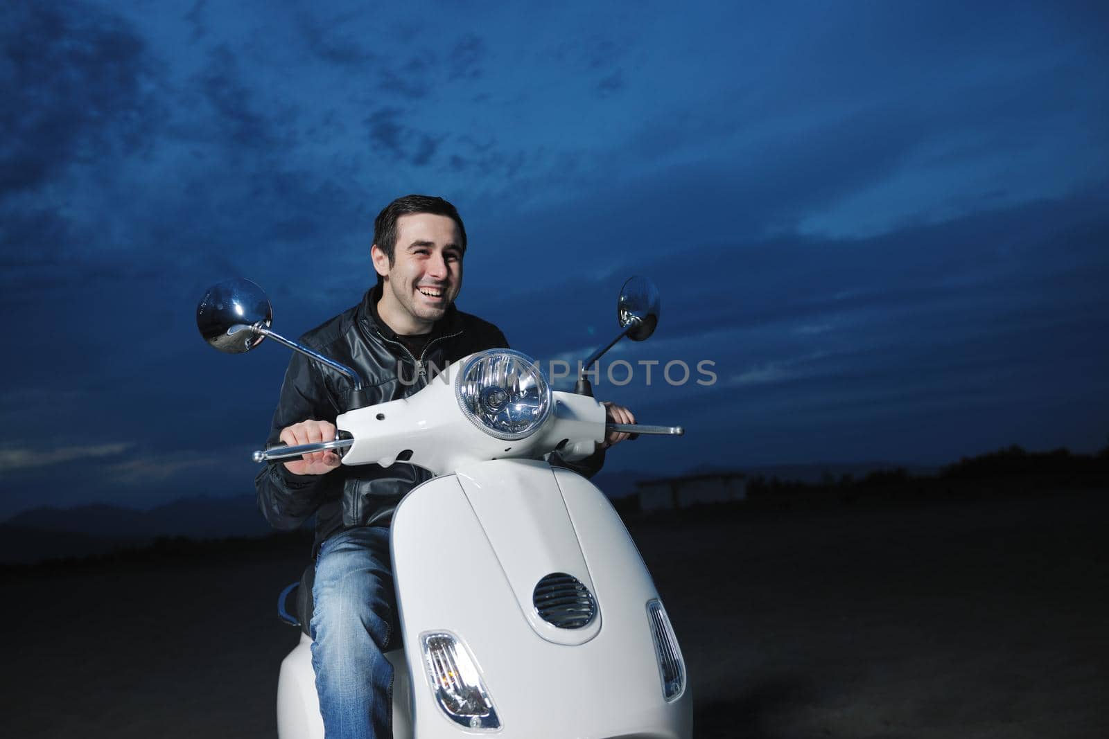 young man ride retro vintage motorbike scooter