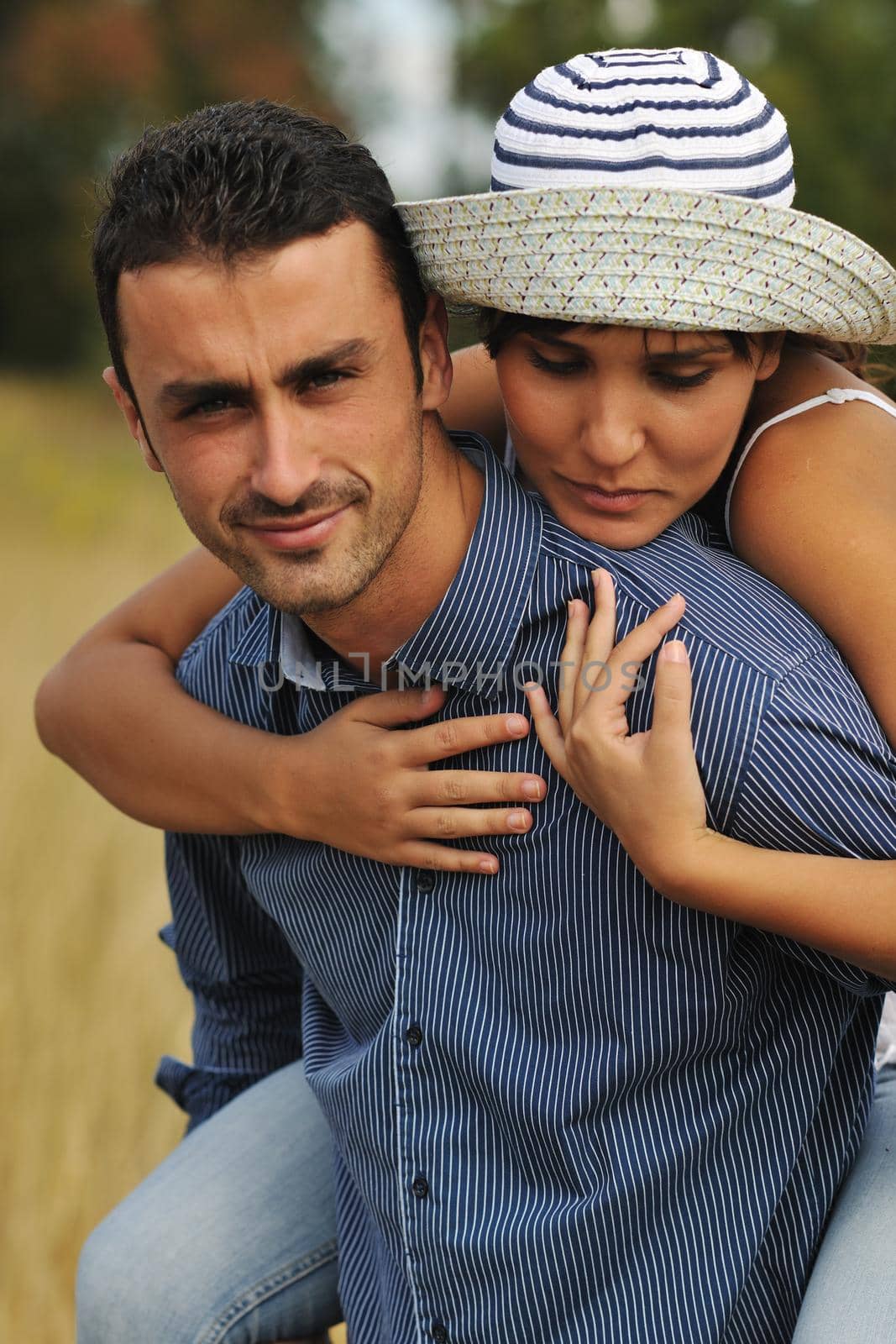 happy young couple have romantic time outdoor while smiling and hug