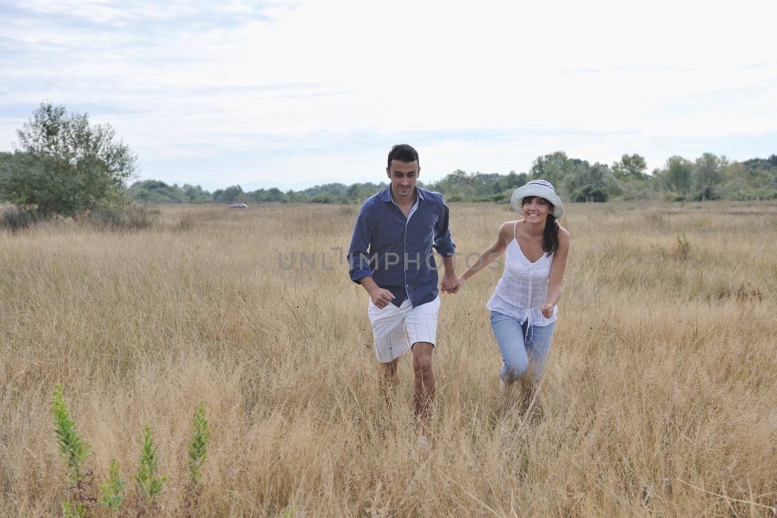 happy young couple have romantic time outdoor while smiling and hug