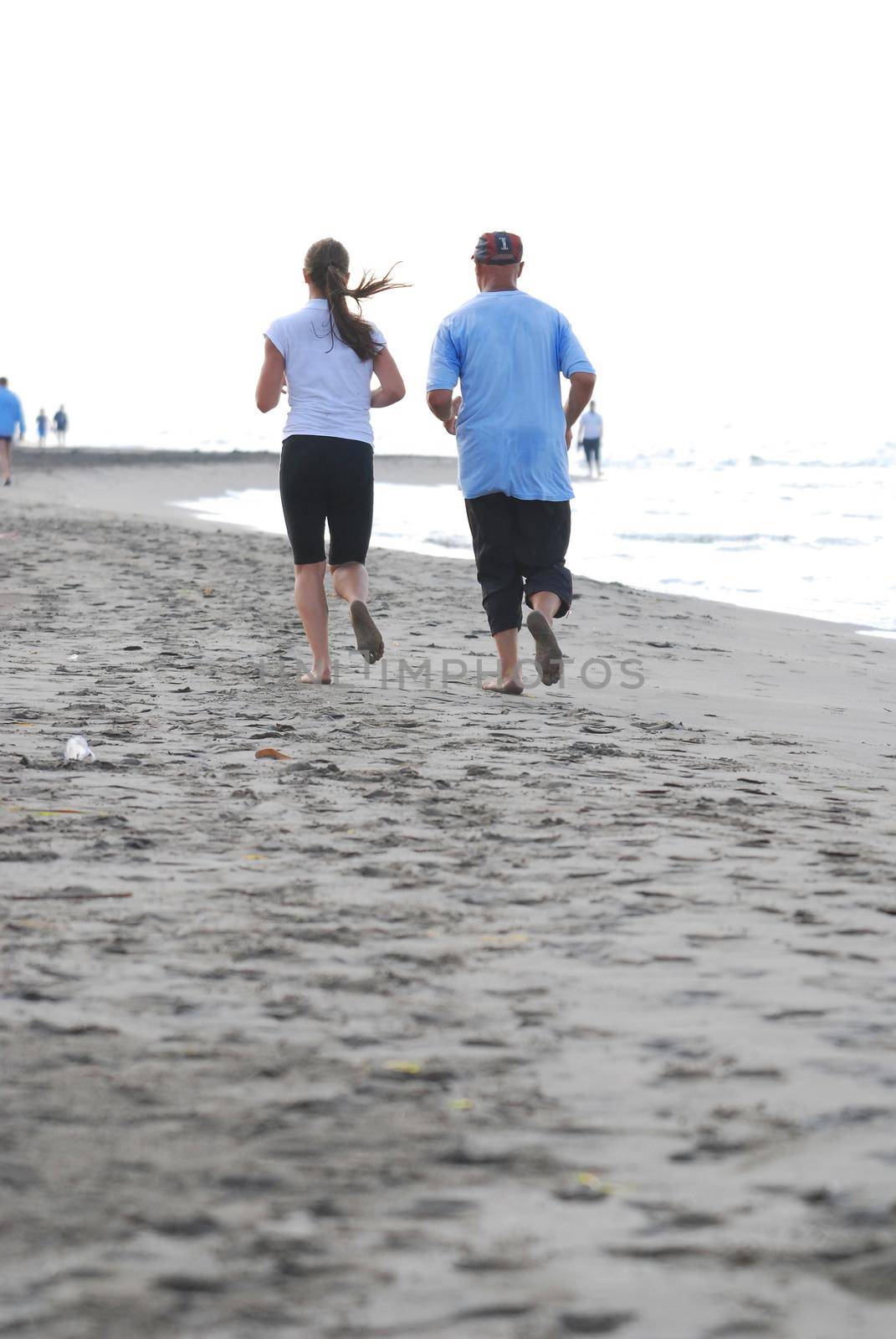 couple running on beach