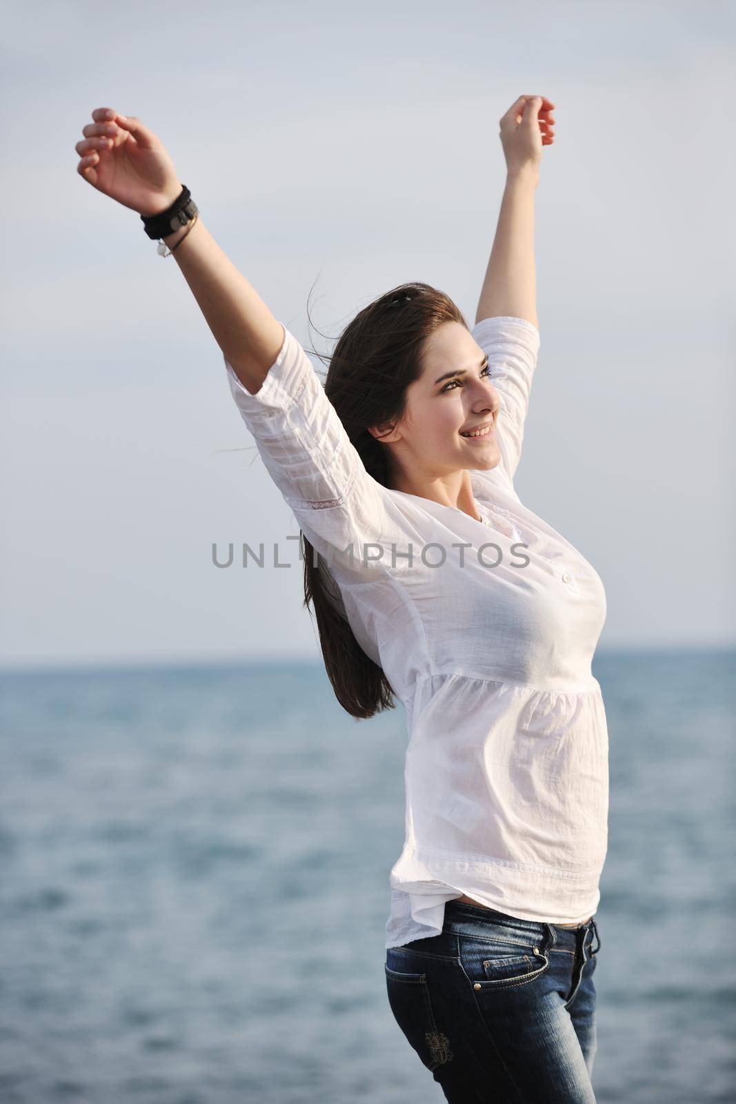 young woman enjoy on beach by dotshock
