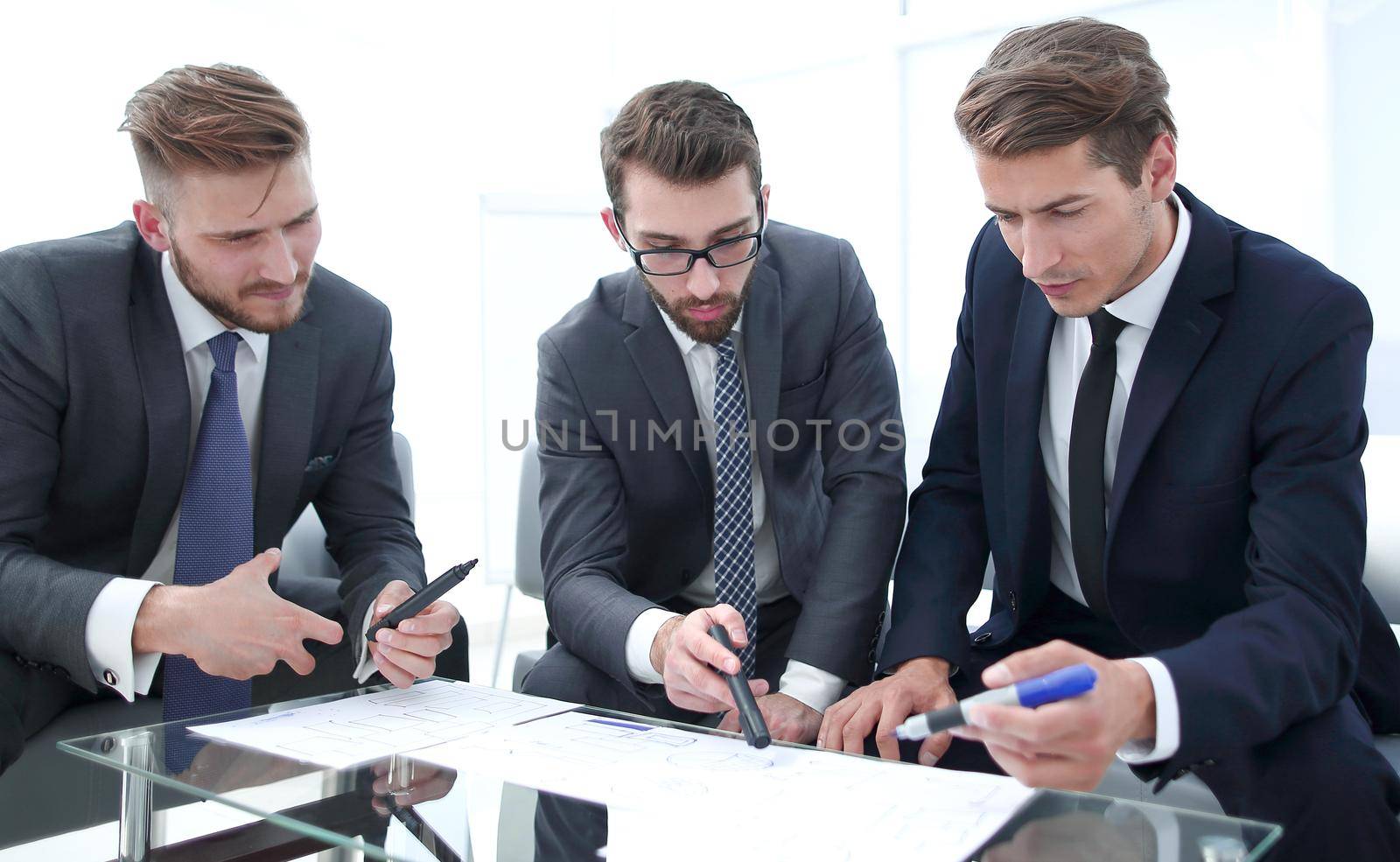 lawyer explains to business partners the terms of the new contract.business concept