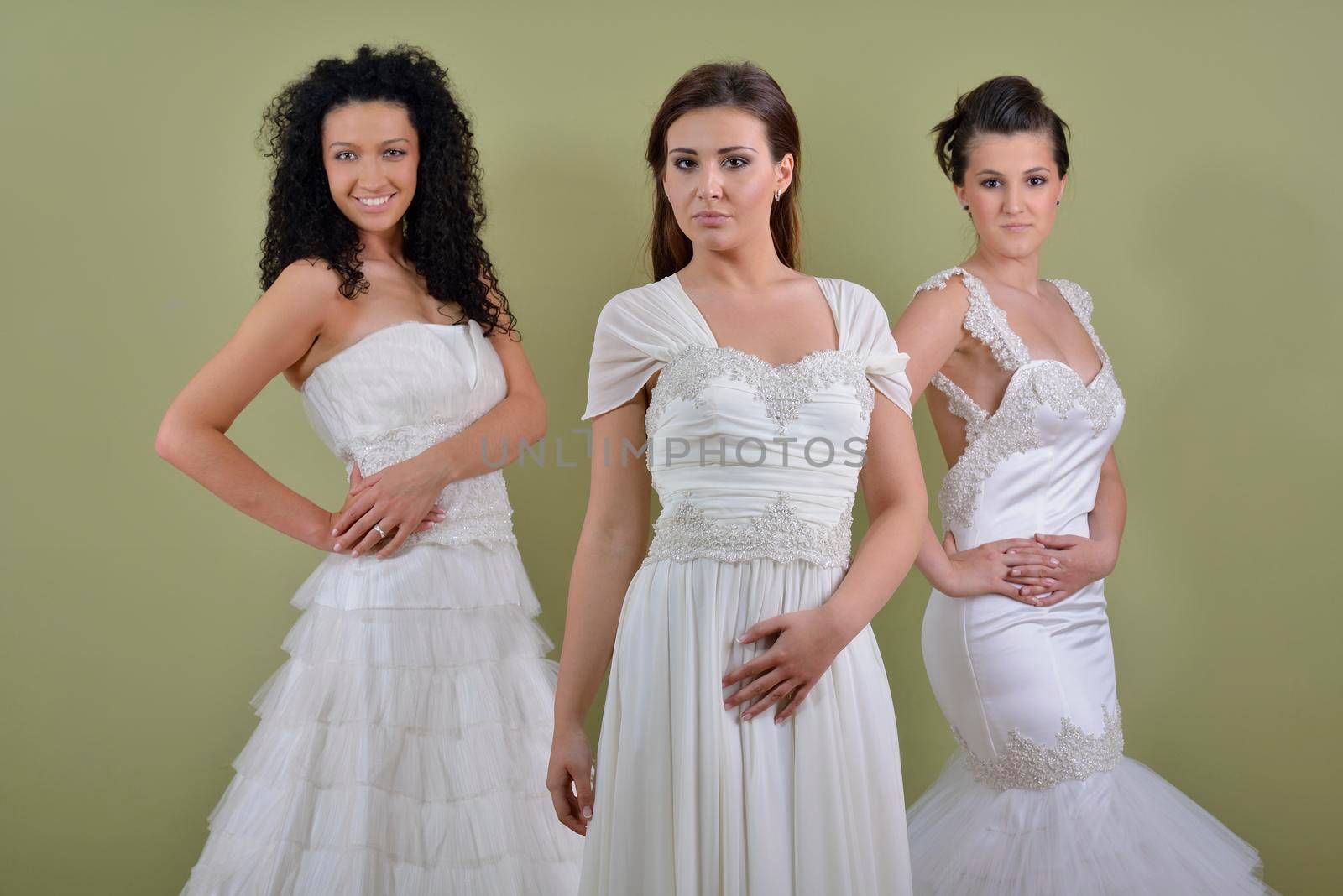 portrait of a three beautiful woman in wedding dress, bride and her friends bridesmaid