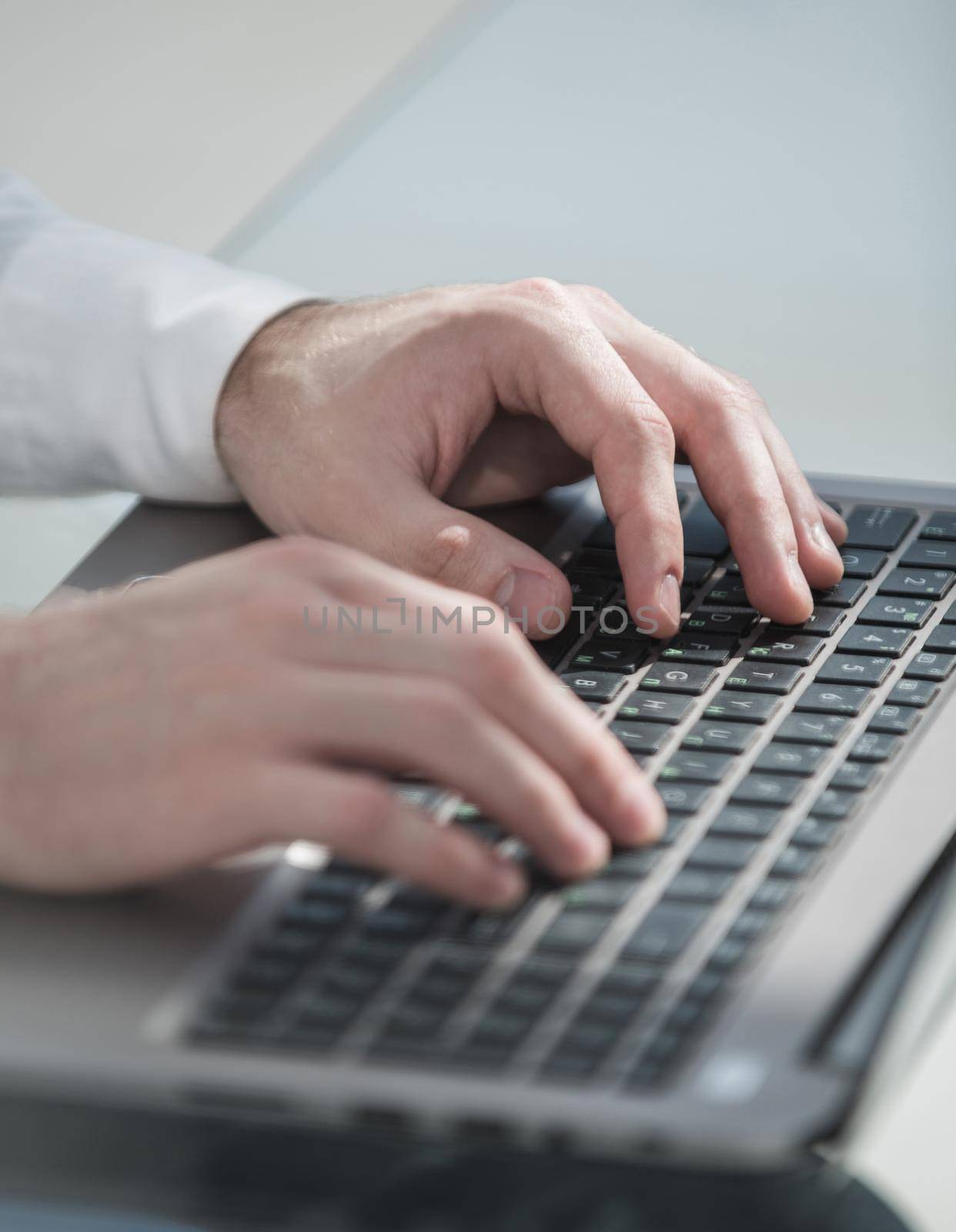 close up.businessman typing on a laptop. people and technology