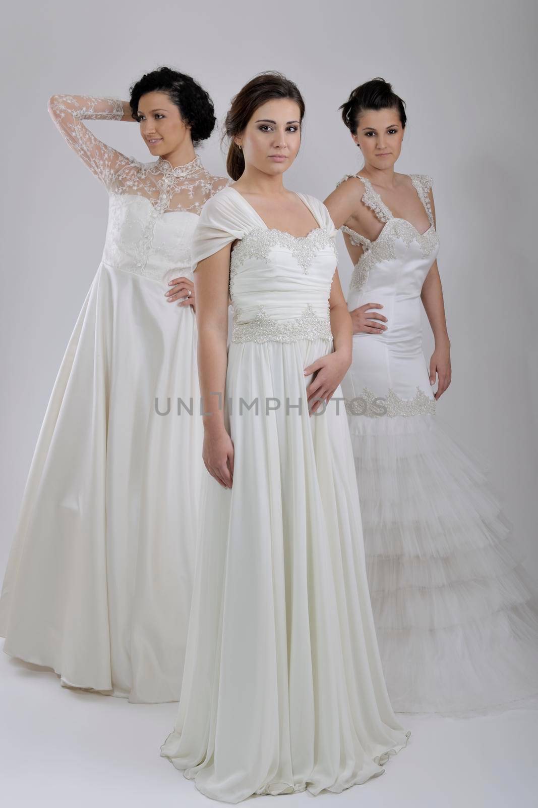 portrait of a three beautiful woman in wedding dress by dotshock
