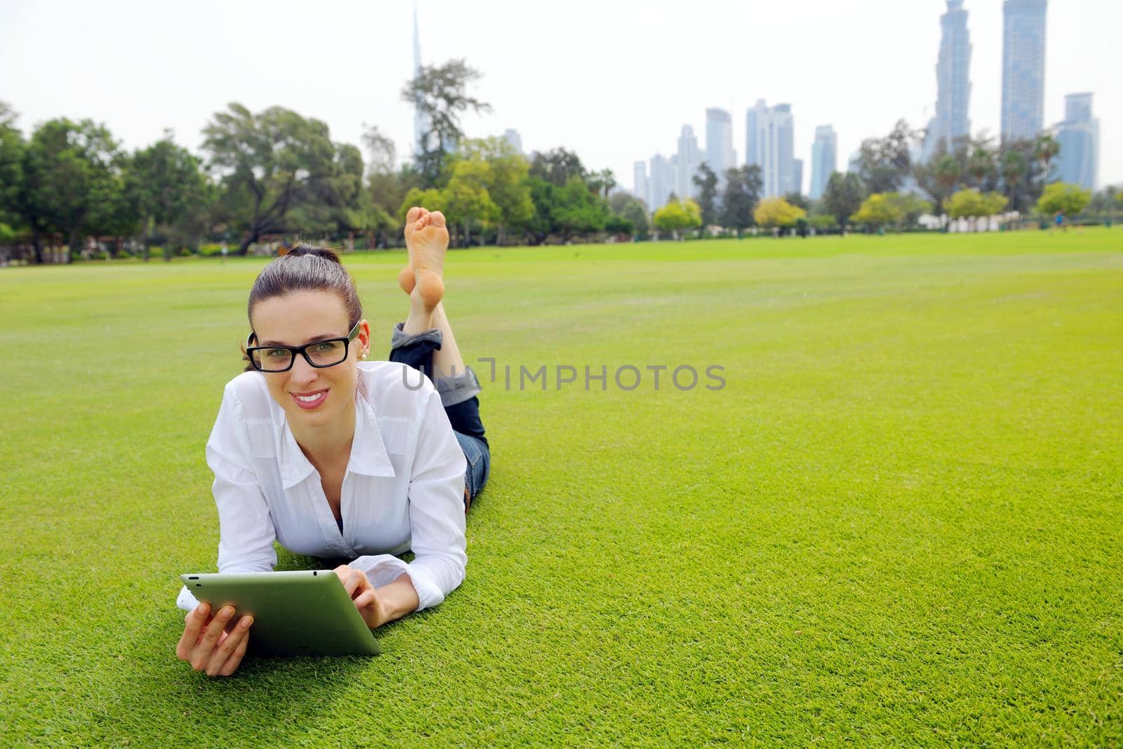 Beautiful young student  woman study with tablet in park