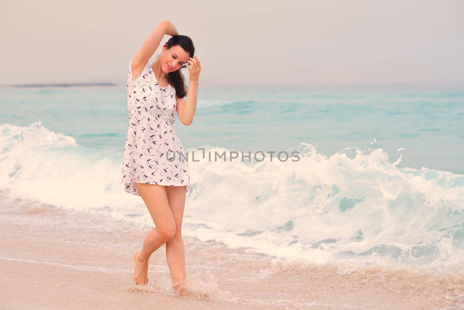 Happy Beautiful Woman Enjoying Summer Vacation on beach