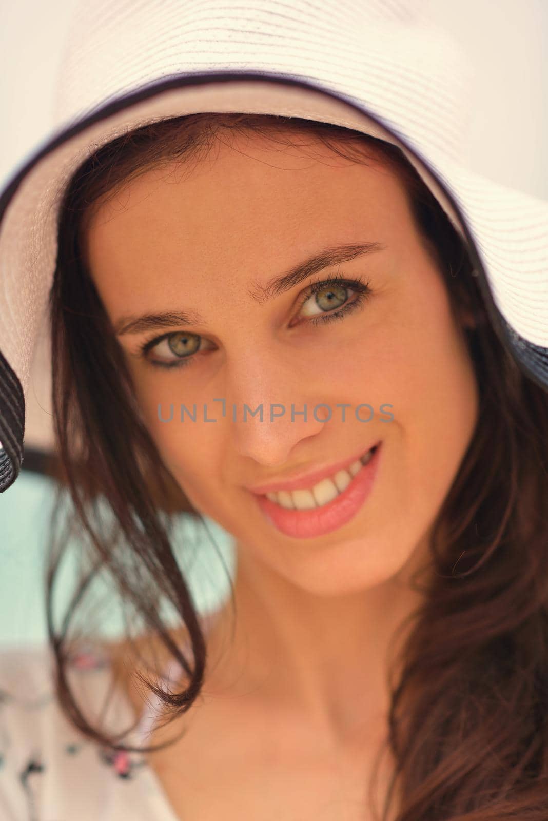 portrait of happy young woman on beach by dotshock