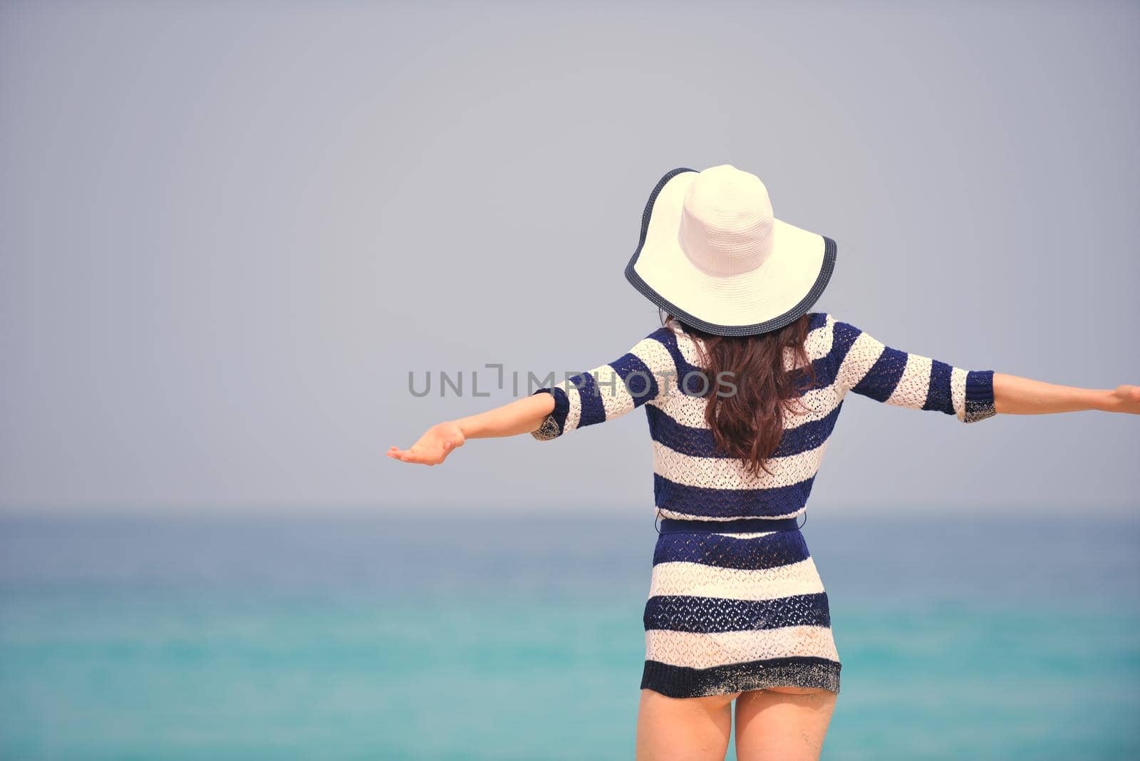 Happy Beautiful Woman Enjoying Summer Vacation on beach