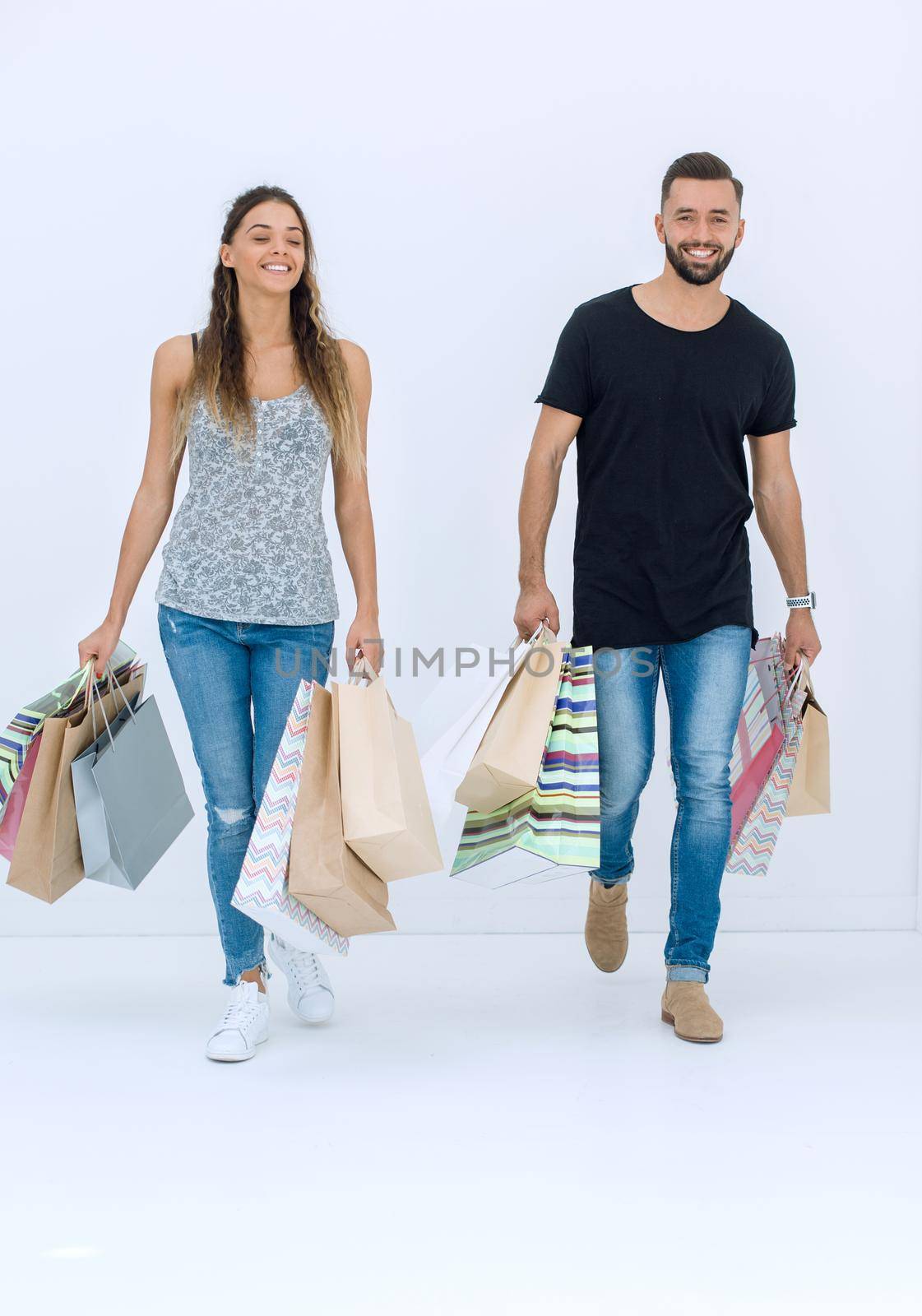 Couple with shopping bags, isolated on white background