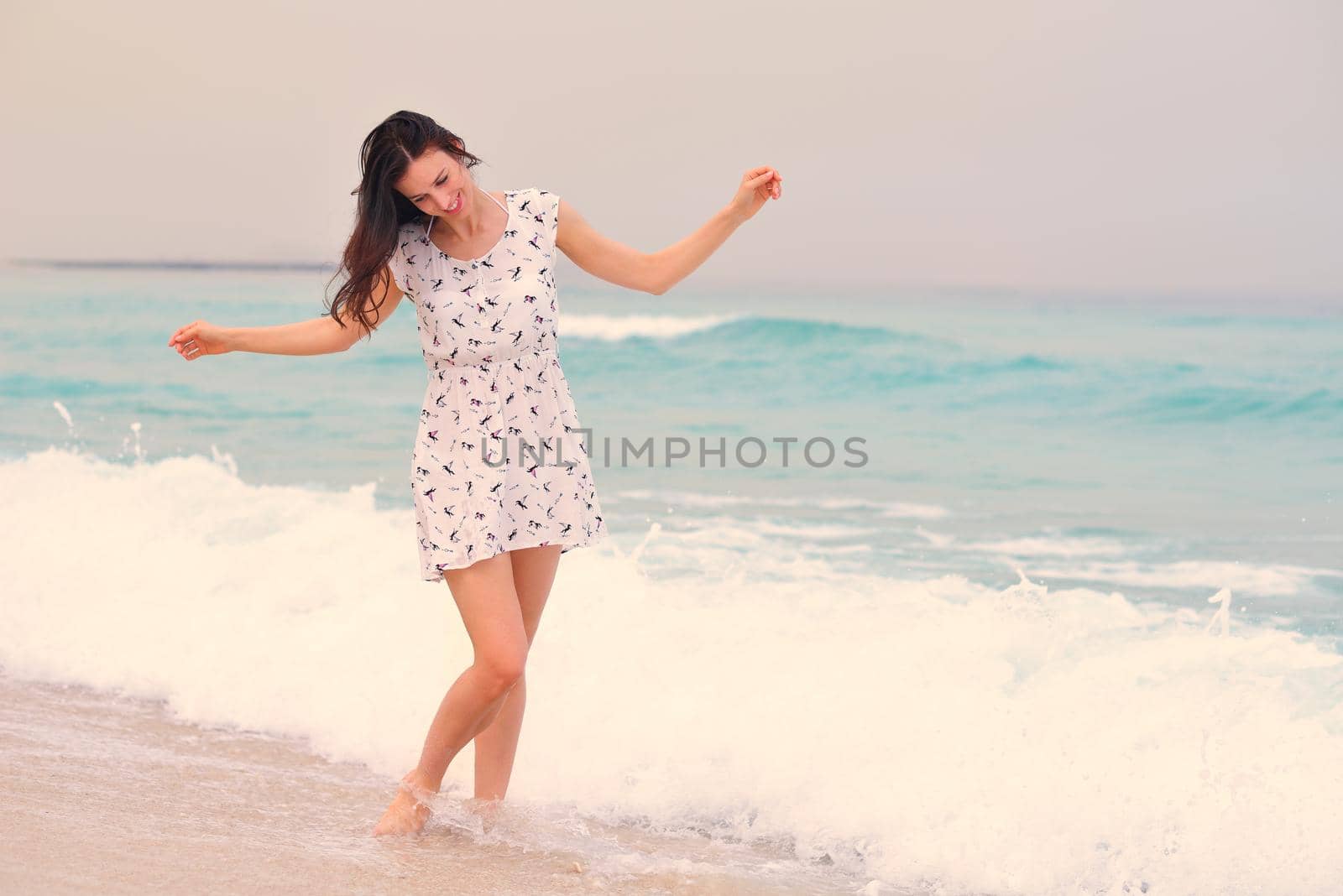 Happy Beautiful Woman Enjoying Summer Vacation on beach