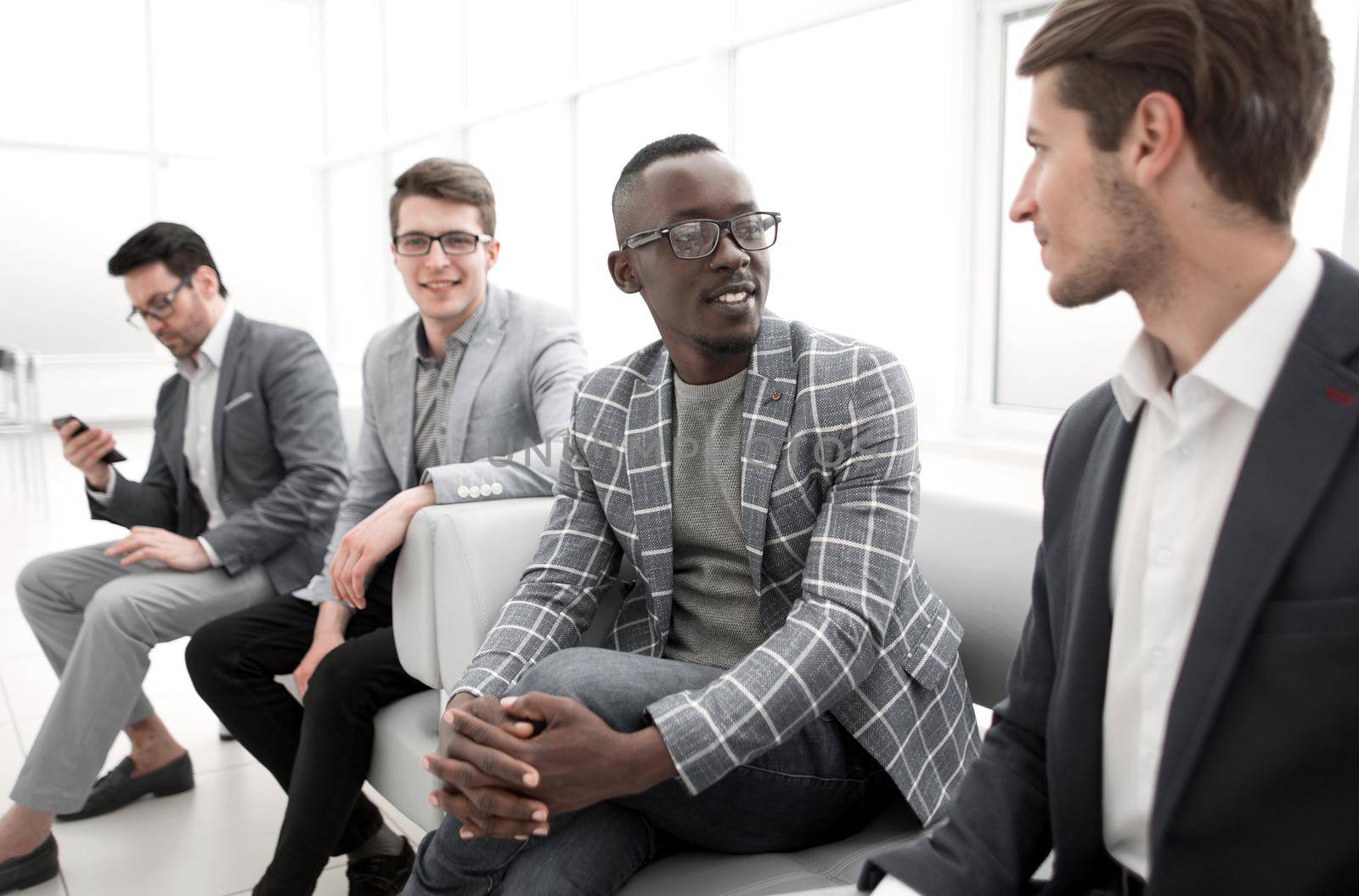 group of business people sitting in the office corridor.business concept