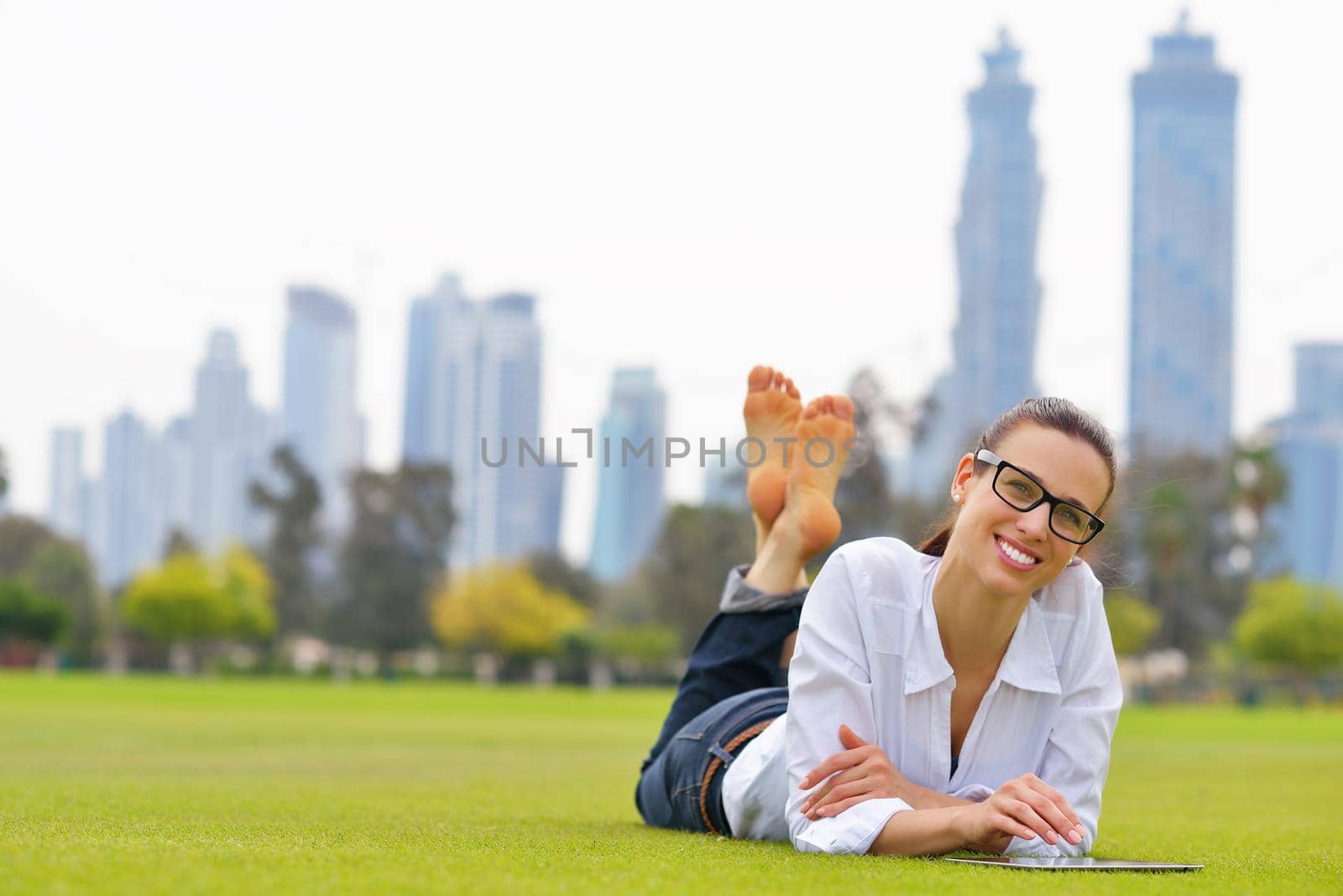 Beautiful young student  woman study with tablet in park