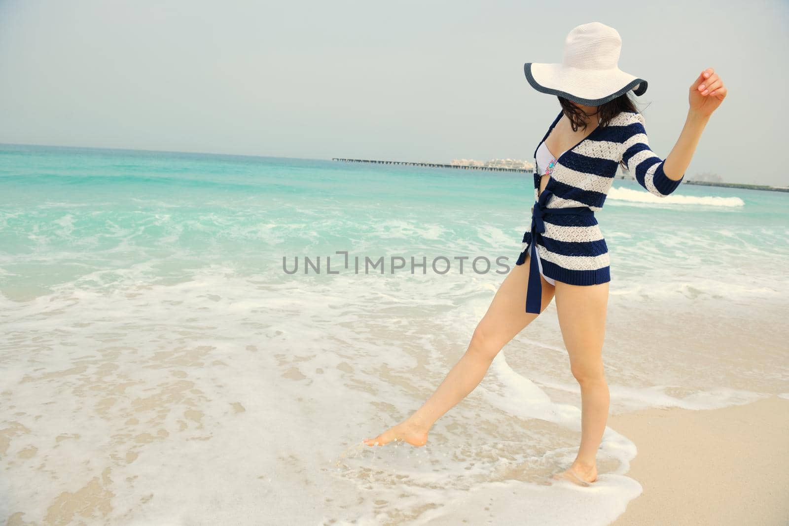 Happy Beautiful Woman Enjoying Summer Vacation on beach