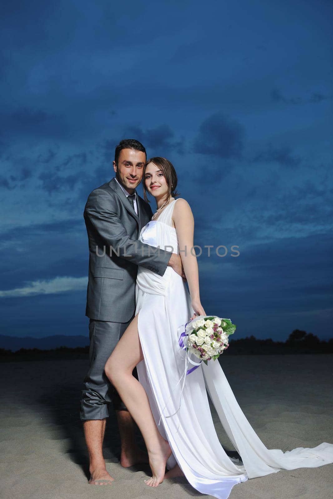 romantic beach wedding at sunset by dotshock