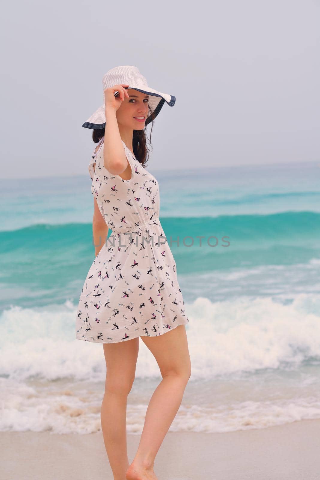 Happy Beautiful Woman Enjoying Summer Vacation on beach