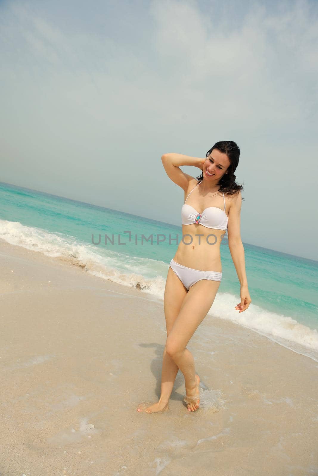 Happy Beautiful Woman Enjoying Summer Vacation on beach